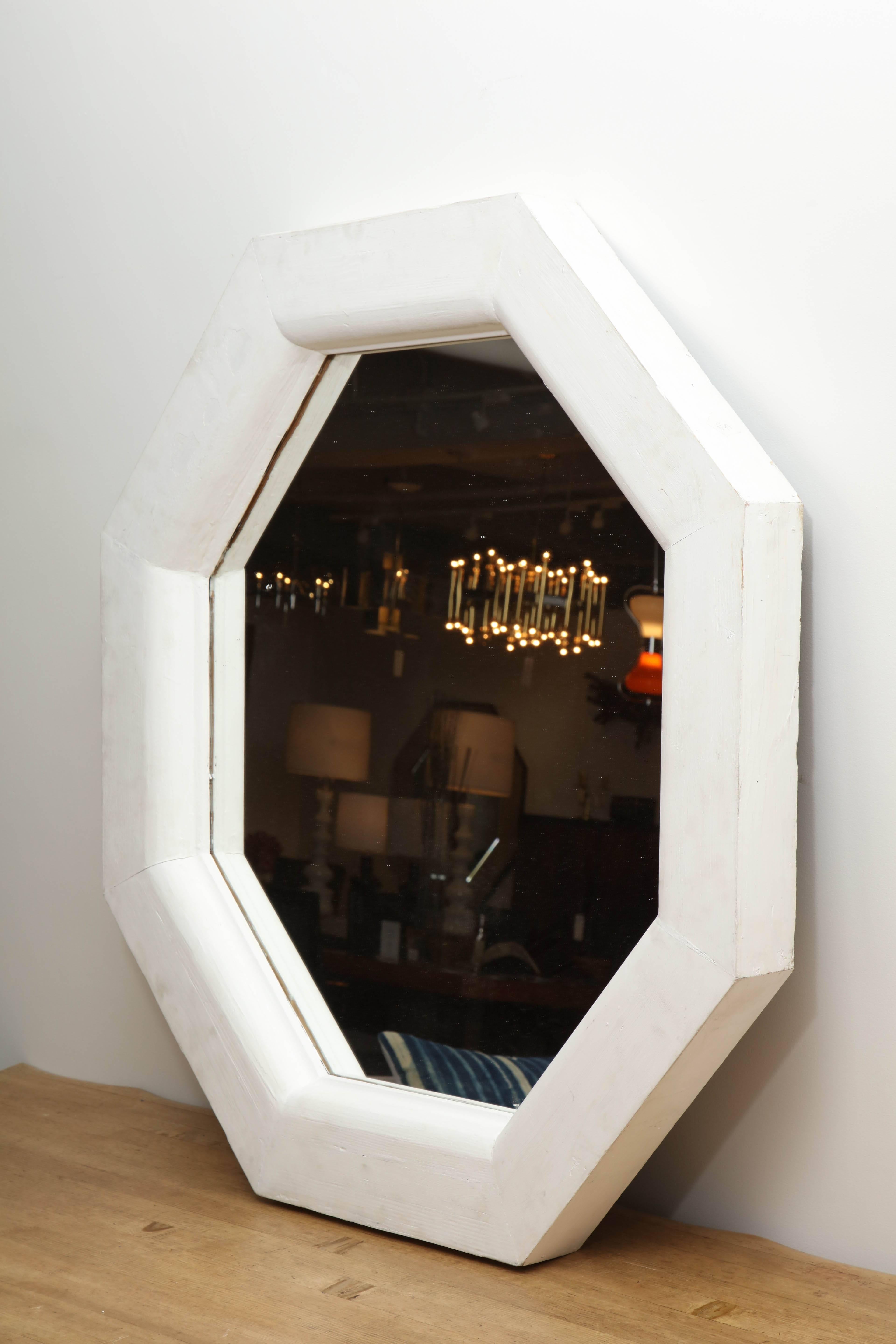 Vintage white octagonal mirror.