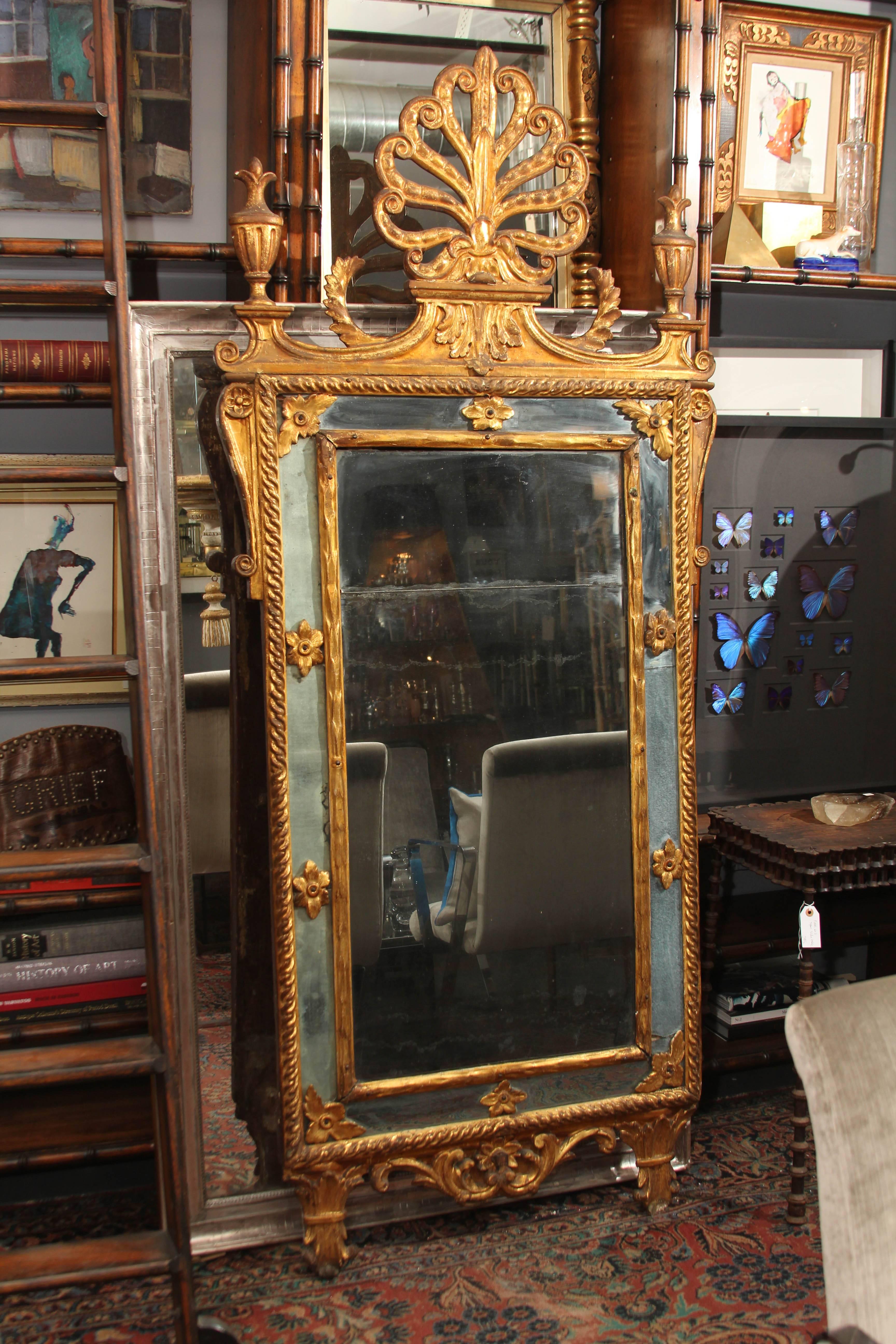 Beautiful ornate 18th century wood and gilt French mirror.