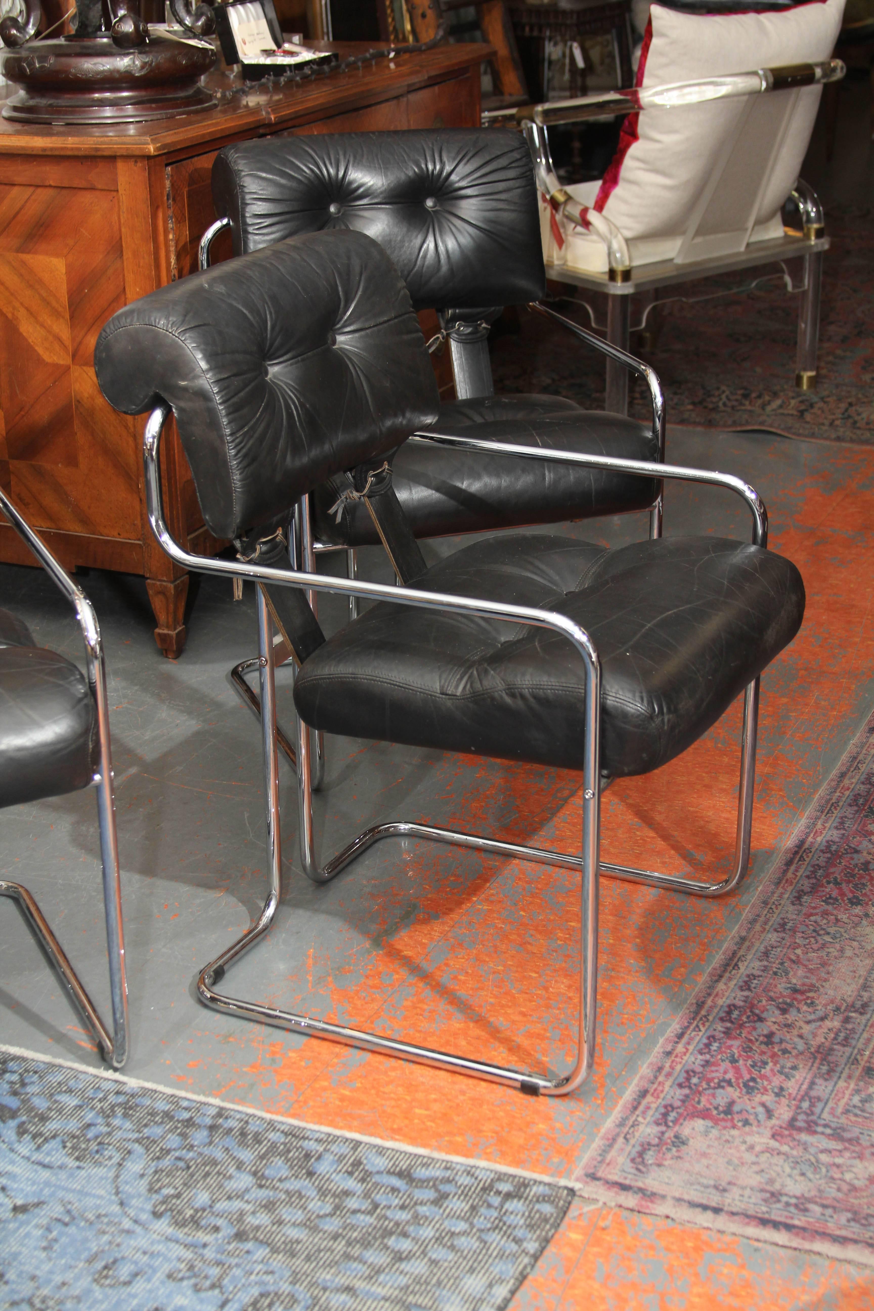 Mariani for the Pace Collection set of four chairs in black leather with leather lacing front and back. Chromed frame, very comfortable chairs. Great as side chairs or at a dining table.