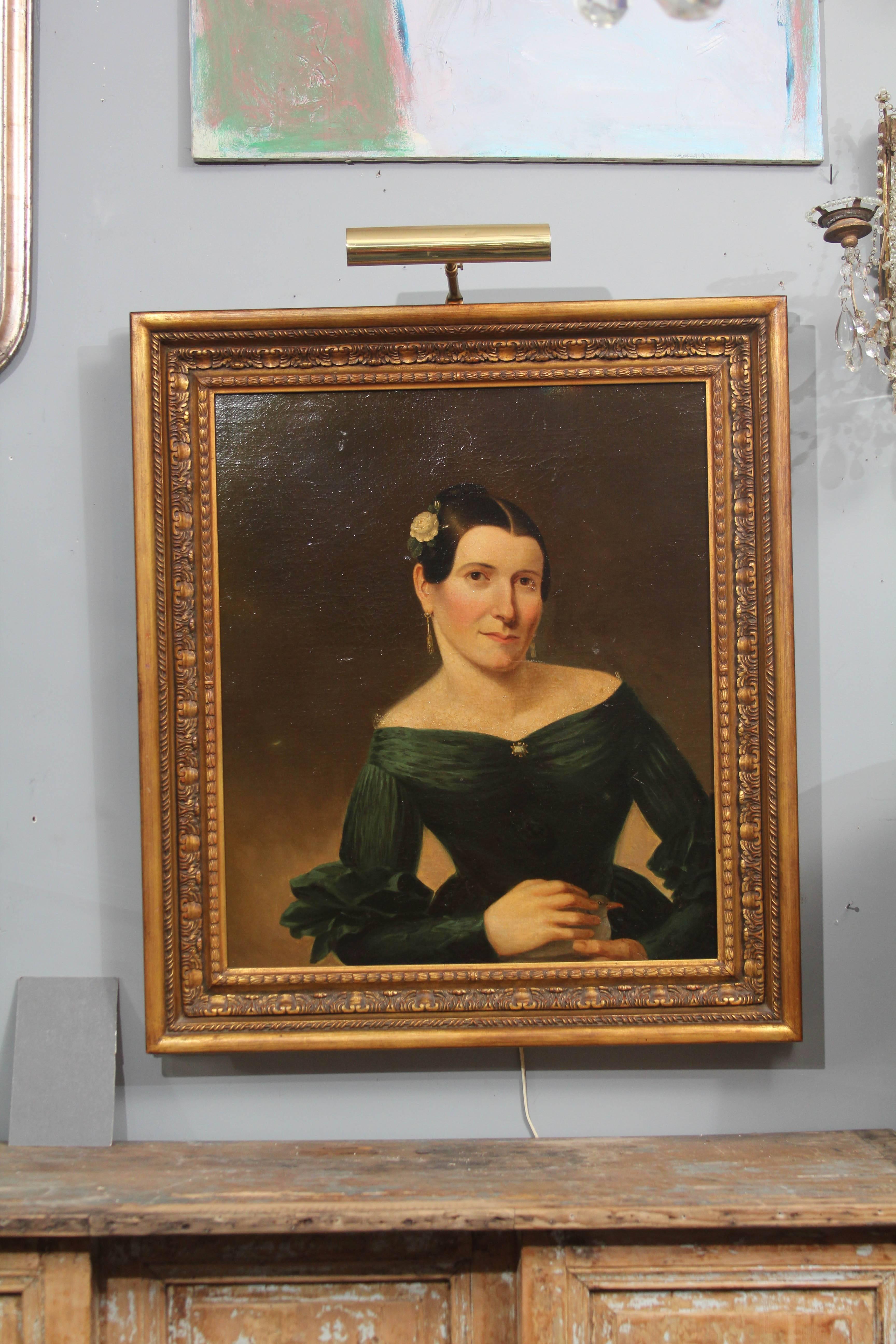 Portrait of woman holding a bird, circa 1860-1880, France
Reframed in late 20th century.