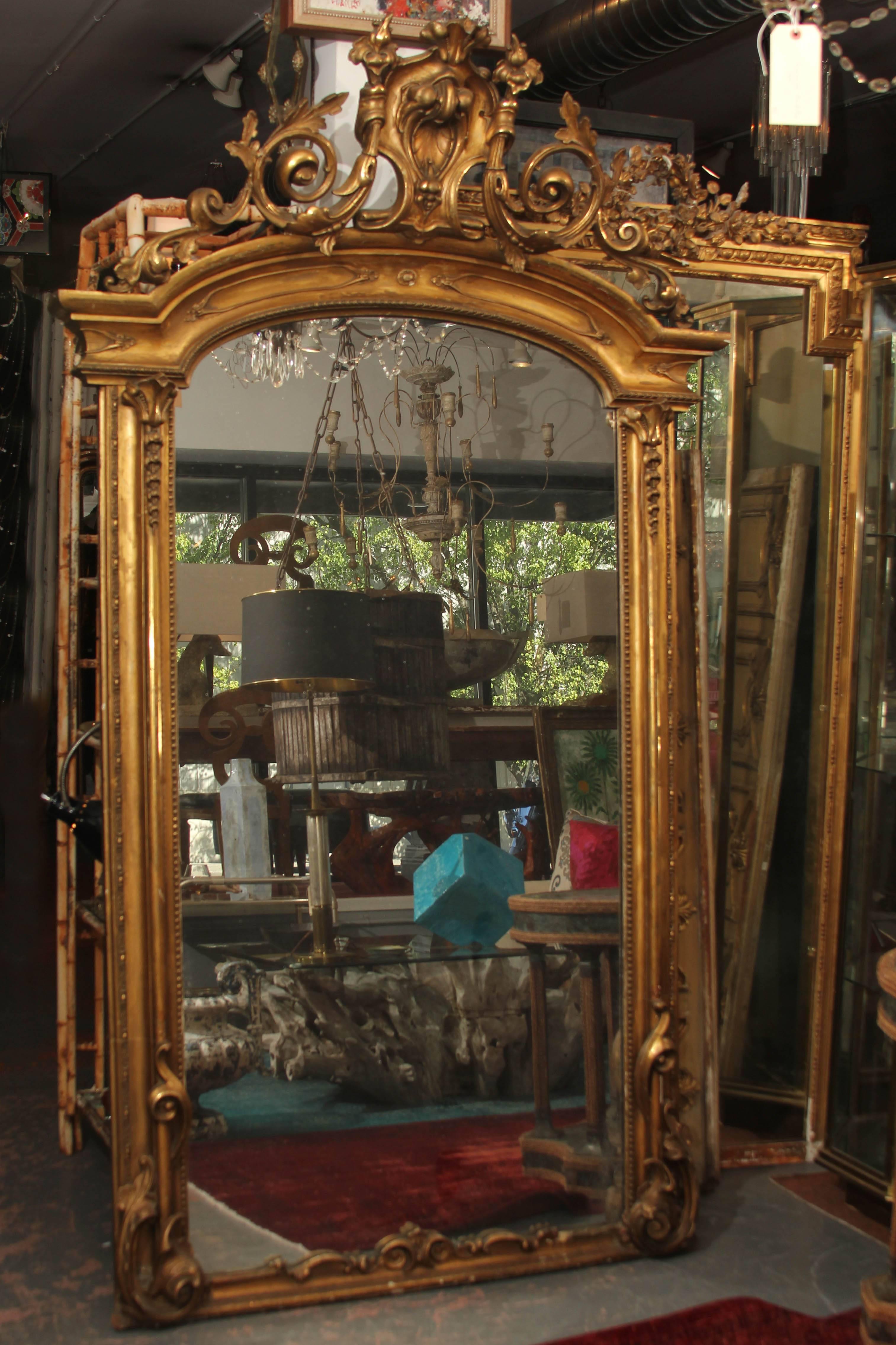 Beautiful ornate antique floor mirror with original glass. Great color and patina to the frame and lots of sparkling diamond dust in the mirror when the light hits it just right.