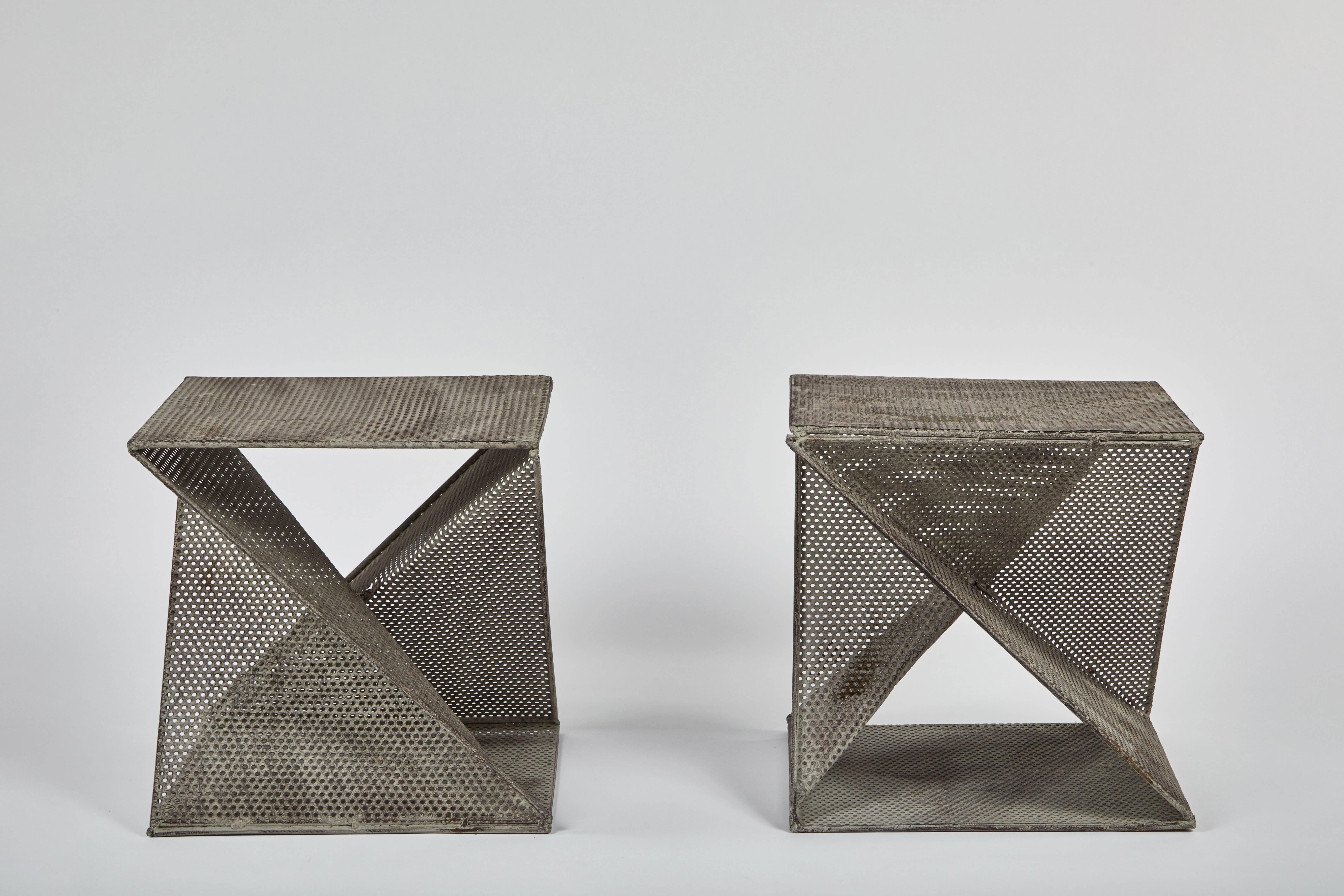 Pair of geometric perforated metal side tables in the style of Mathieu Matégot, in original condition.