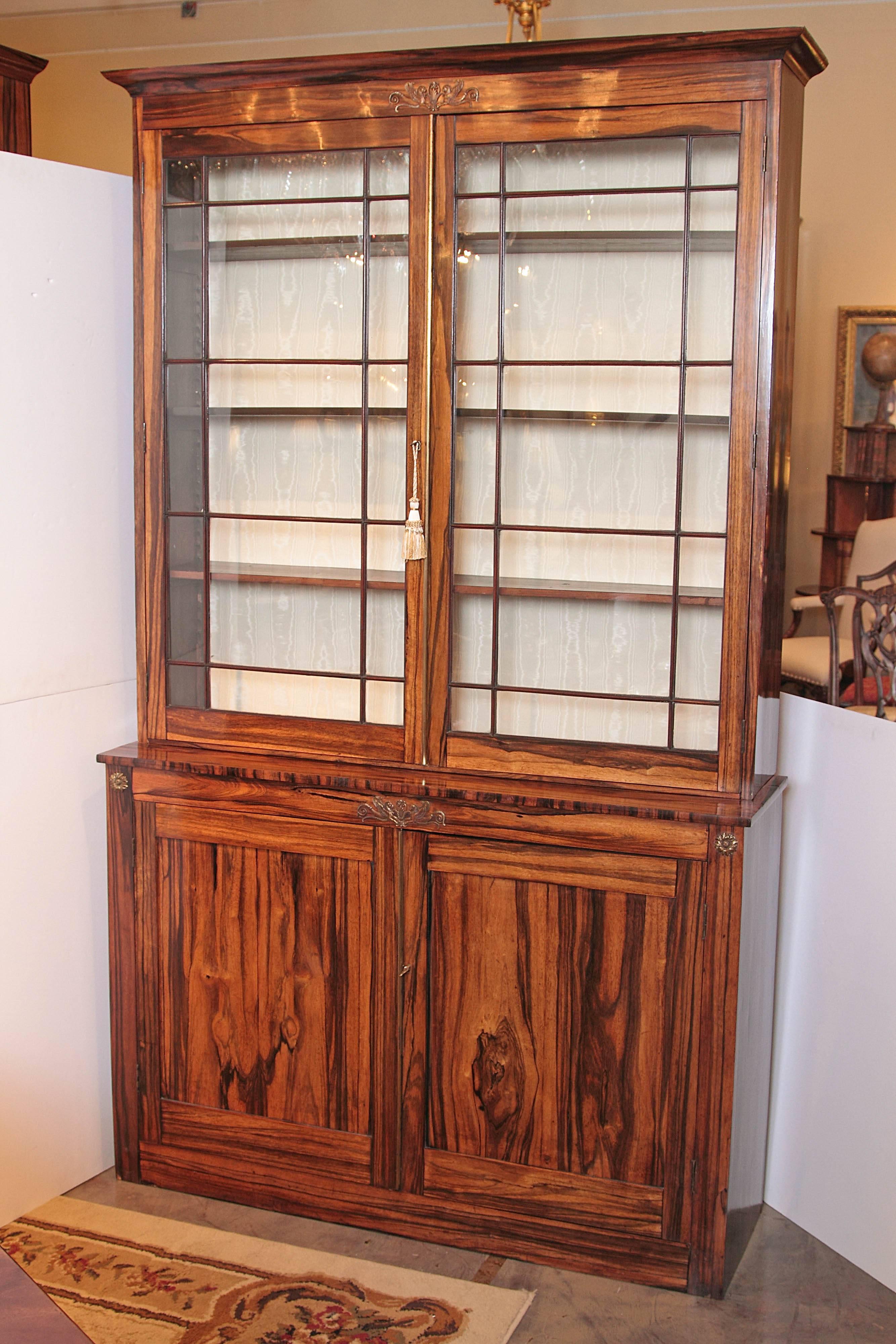 Pair of very fine period Regency rosewood or calamander wood display or bookcasecabinets. Silk lined. Provenance Kentshire Galleries New York

 