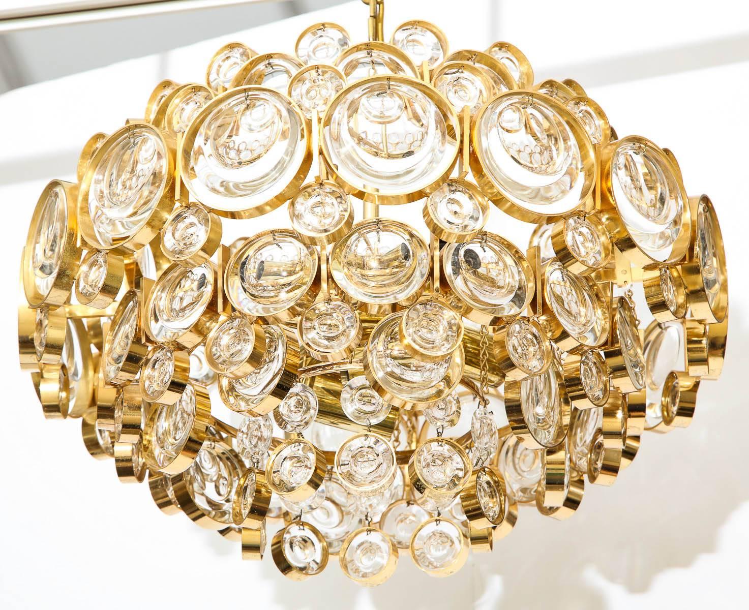 Amazing Austrian optic crystal chandelier on a 22-karat gold over brass frame. The chandelier gives off an amazing glow when illuminated and has been rewired for use in the USA using candelabra type bulbs.