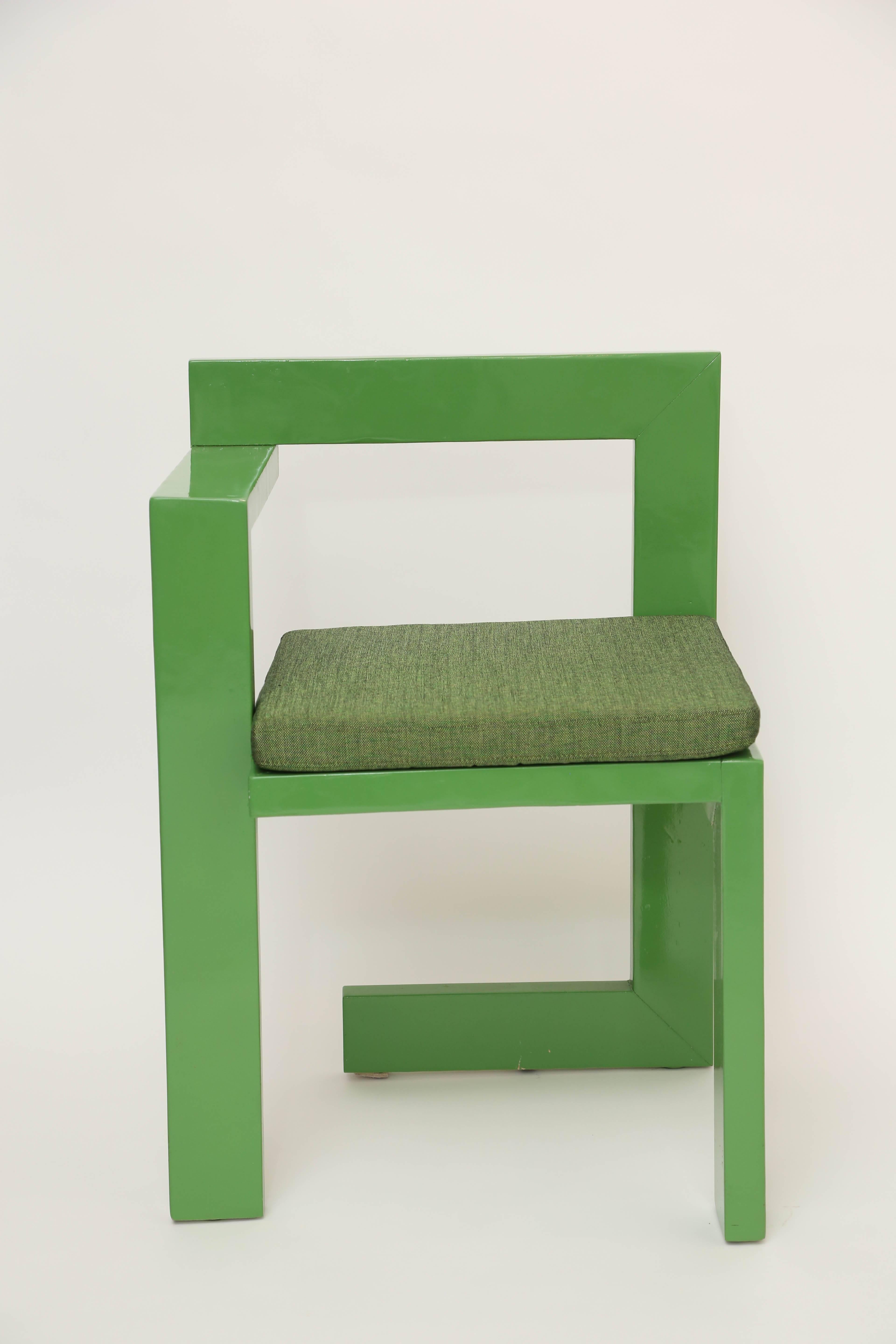 Green lacquer wood chair with loose seat cushion.