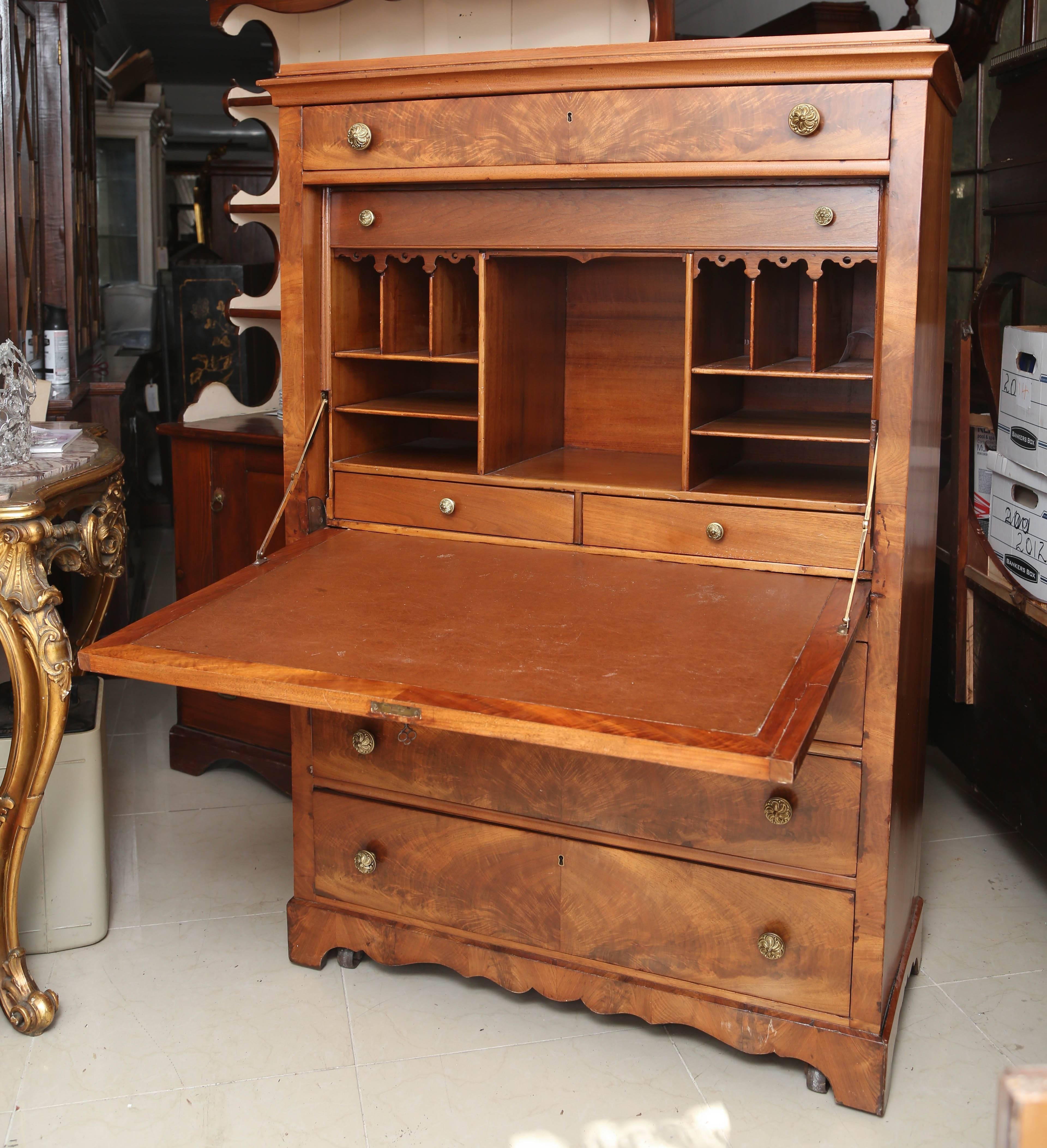 This is a very nice antique walnut escritoire made in France, circa 1890 original brass handles inside the flap it has drawers with again with original price handles pigeon holes and a leather brown surface for writing. Measurements are 42 x 19 x 62.