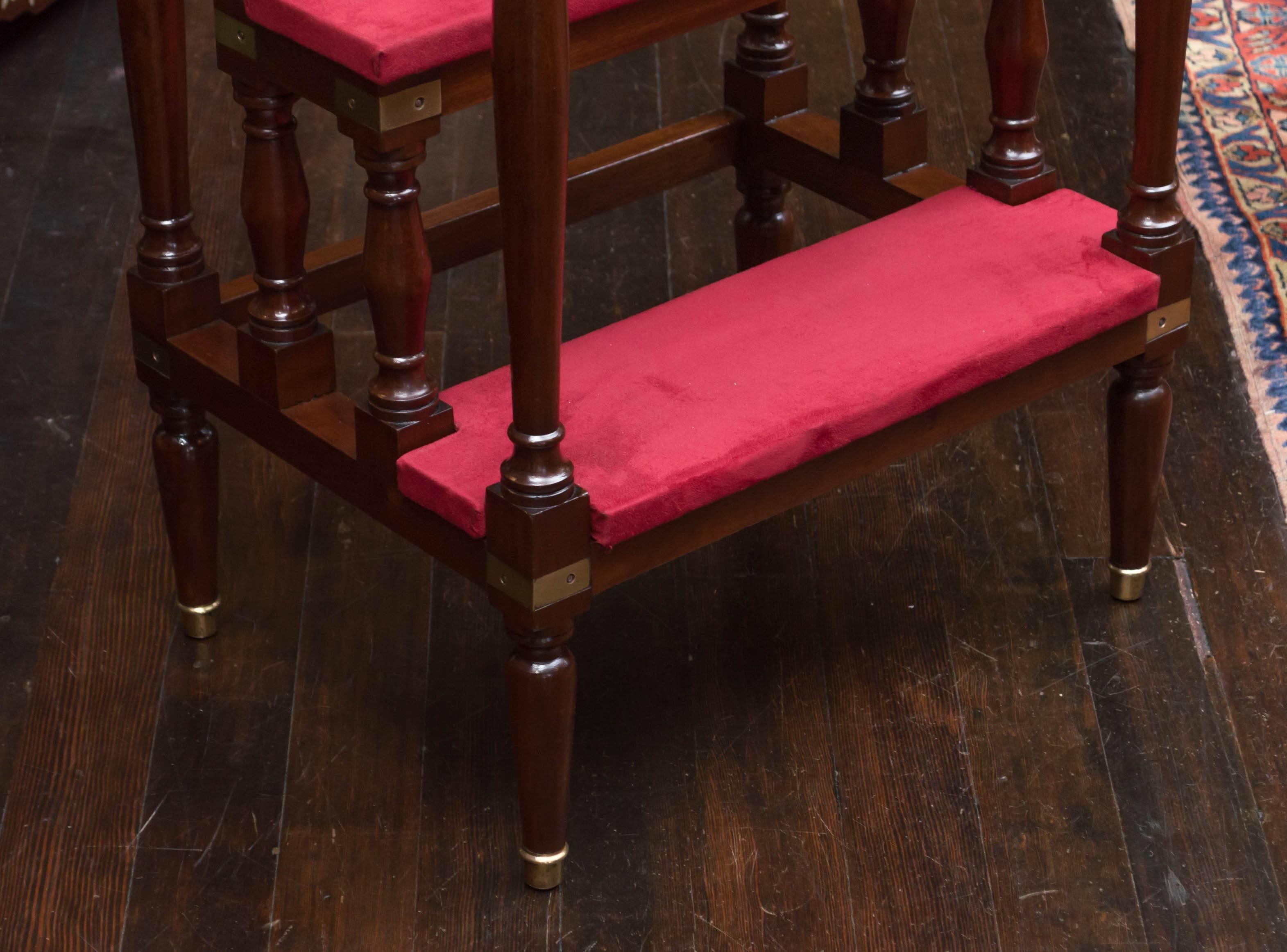 English Regency style mahogany library stairs, circa 1925
Three steps with hand rails joining the tops of the extended legs. The upper two stairs joined with turned supports underneath. Mortise and tenon joinery with brass angle brackets. An