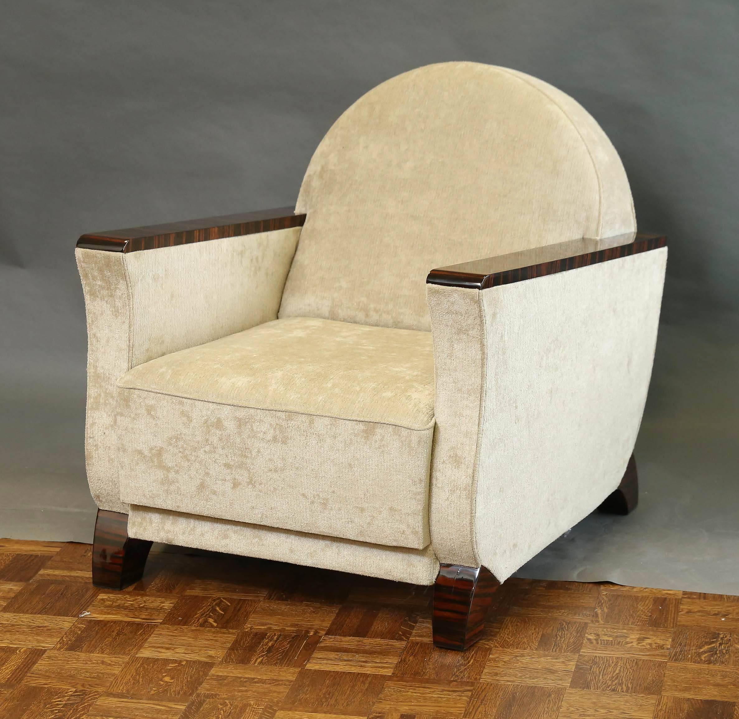 French armchairs are newly re-upholstered in a light grey fabric. Armrests are covered with wooden panels made out of Macassar. Chairs have semi-circular form of back. Chairs are elevated and supported by the Macassar rectangular