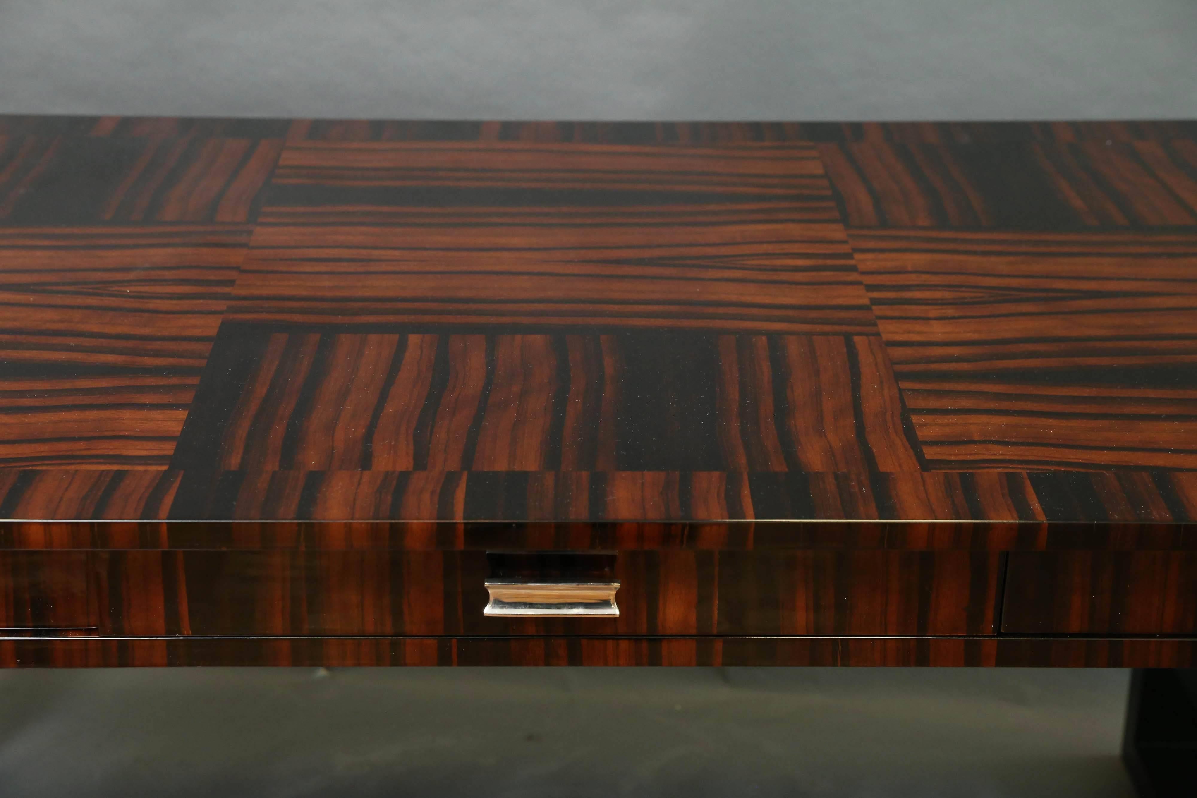 Great veneer selection. Walnut and ebony. 
 Under the flat rectangular top and three drawers. Resting on two large square ebonized legs on both ends and connected with a long single middle ebonized stretcher. 
Restored. Designed by Farkas Molnar