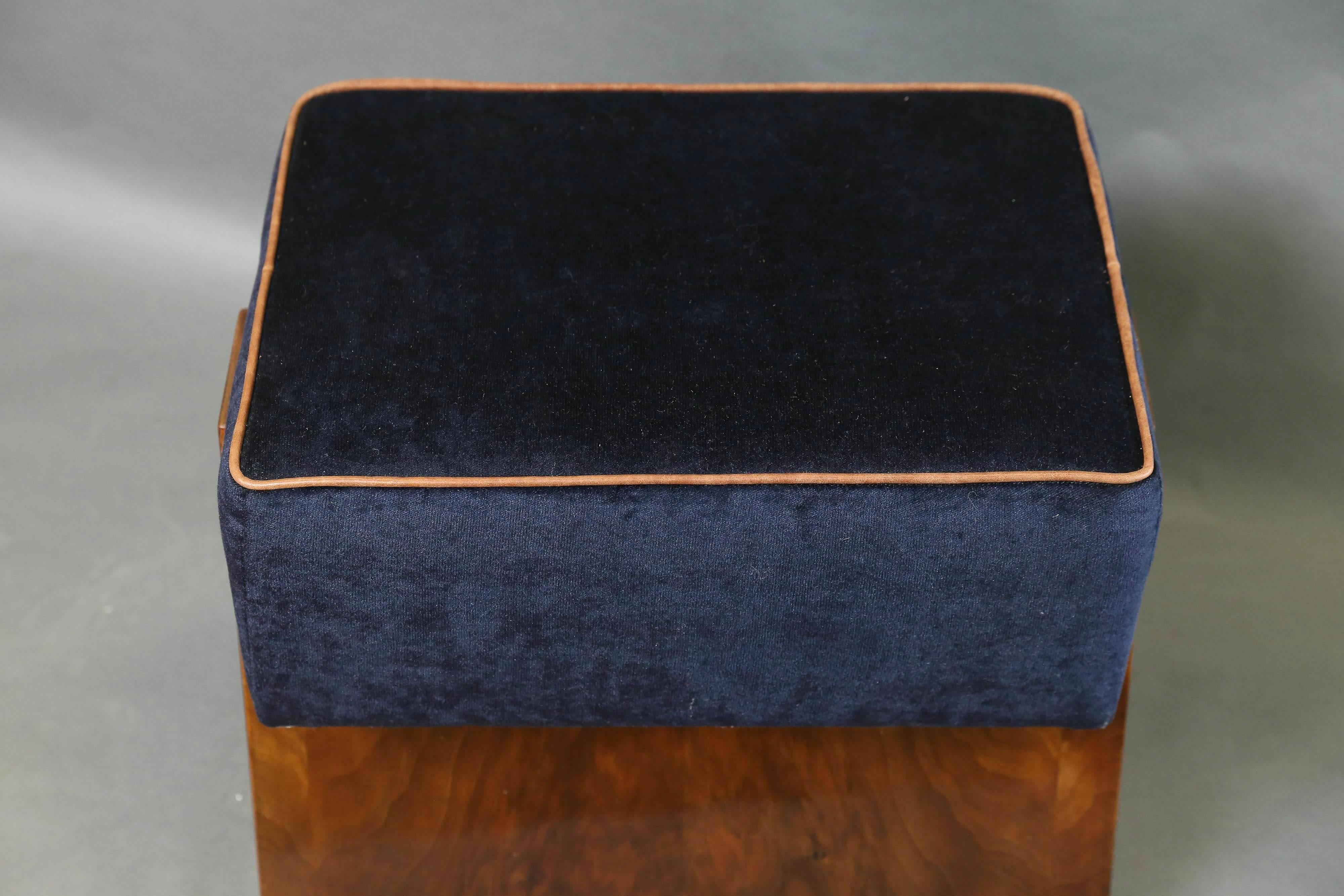 Each ottoman is made out of walnut wood. Newly re-upholstered in a blue fabric. Edges of the top have leather trimming,


 France, circa 1930s.

Measures: 21” W x 13” D x 19” H.
         