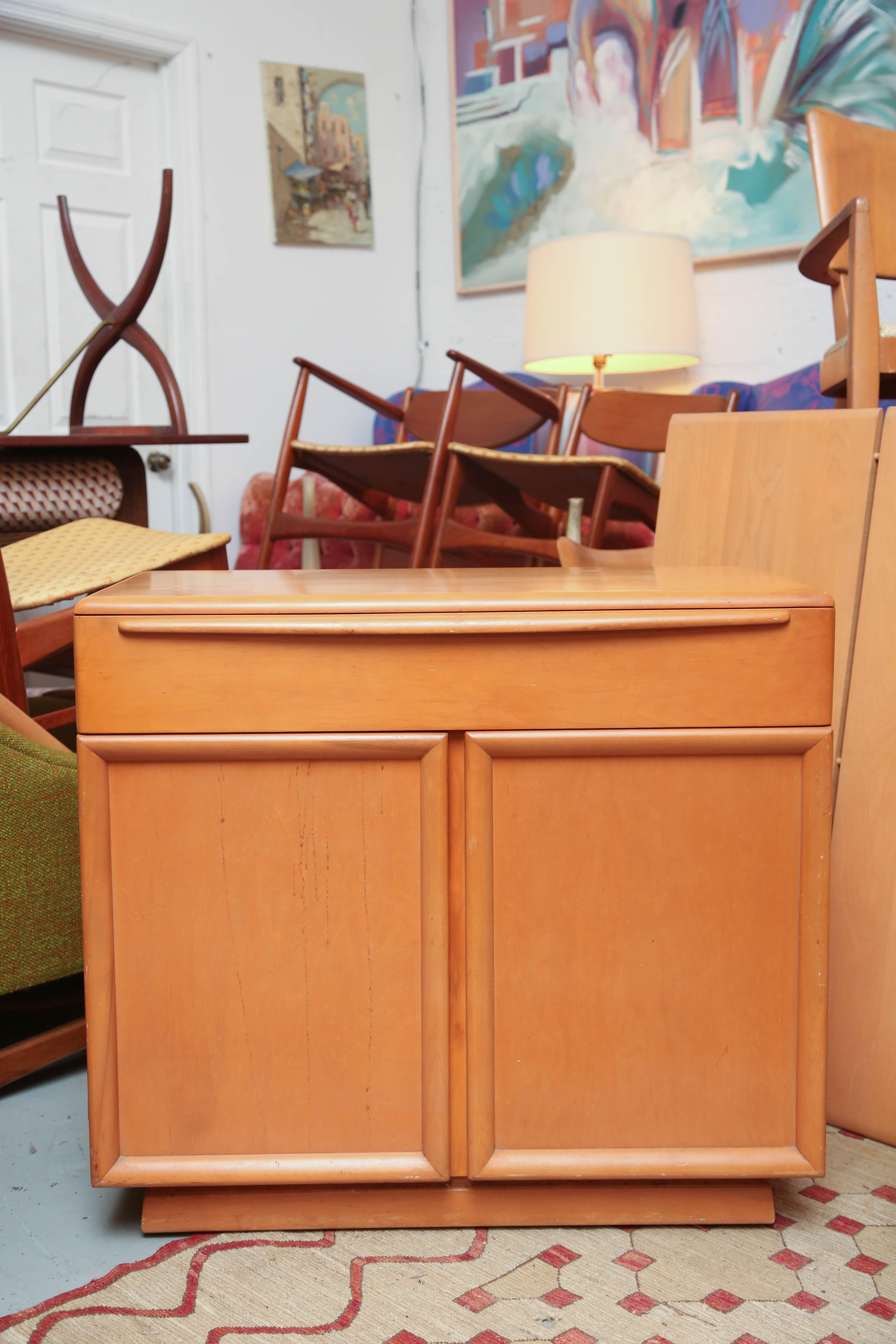 Small credenza or cabinet on wheels for easy moving by Heywood Wakefield.