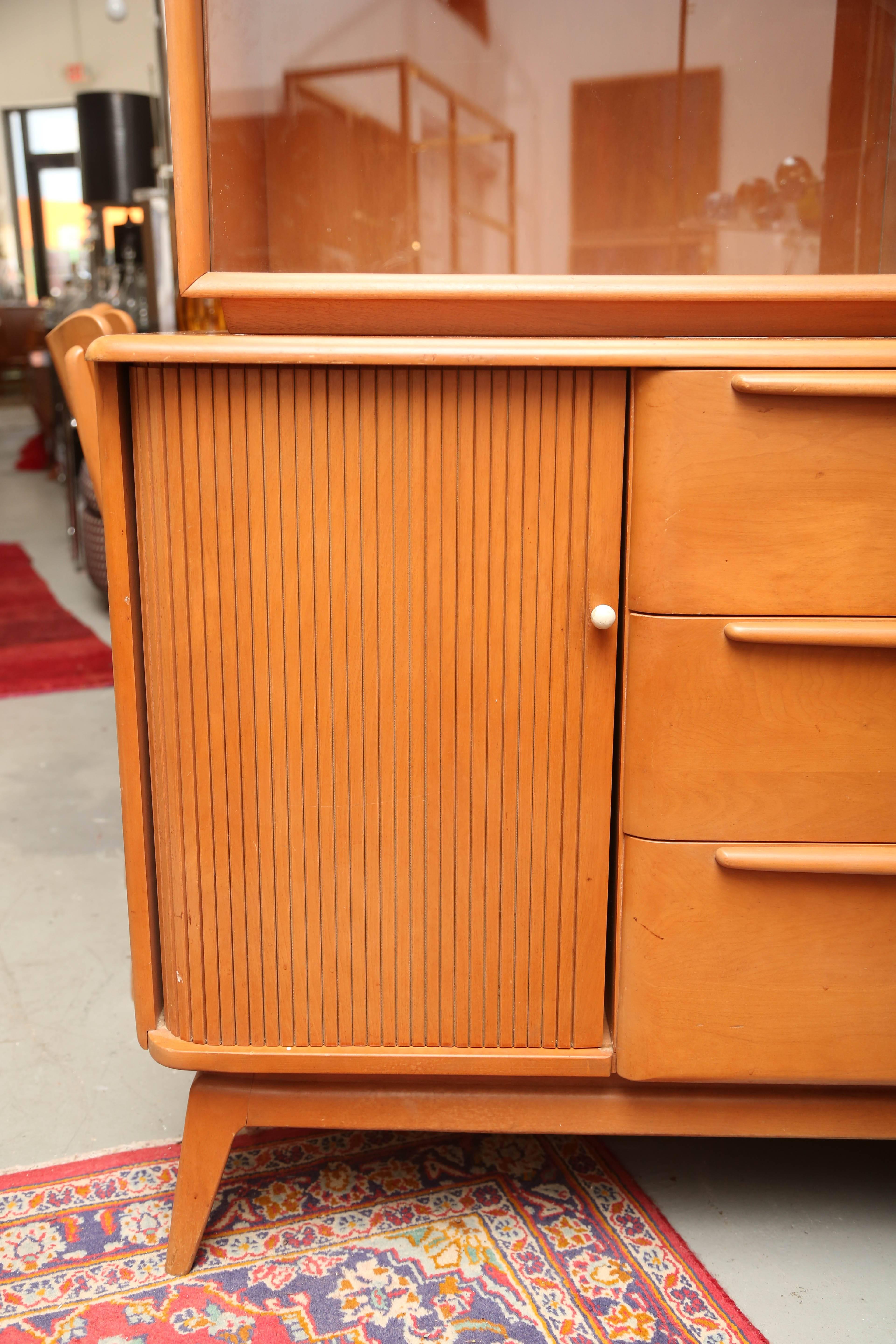Two-piece Heywood Wakefield cabinet that come a part and be used as a credenza or can be used together as a china hutch. A very versatile piece.