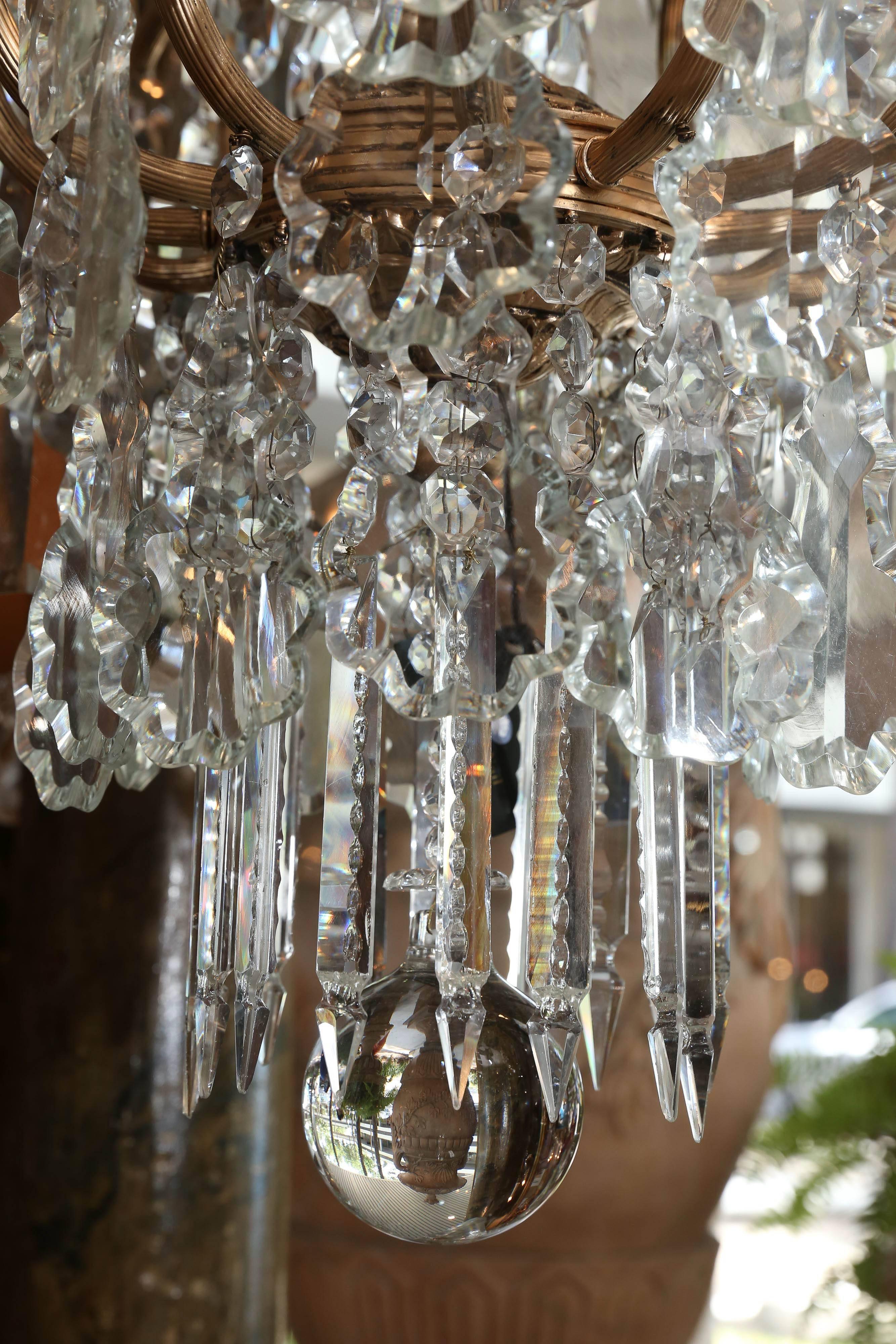 Large French Gilt Metal and Crystal Twelve-Light Chandelier In Excellent Condition In Houston, TX