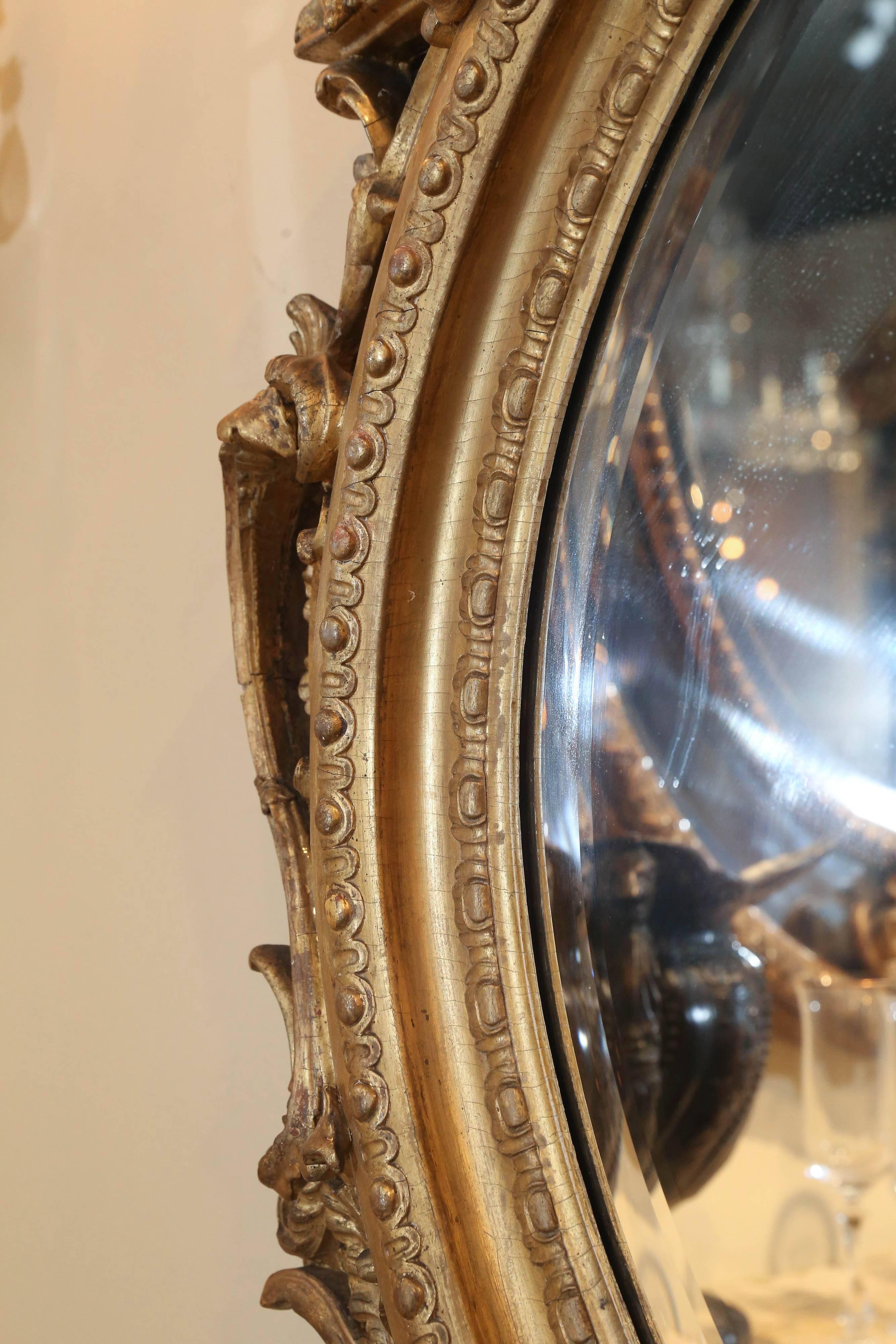 Legno dorato Coppia di specchi ovali in legno dorato Louis Philippe, XIX secolo, gusto rococò in vendita