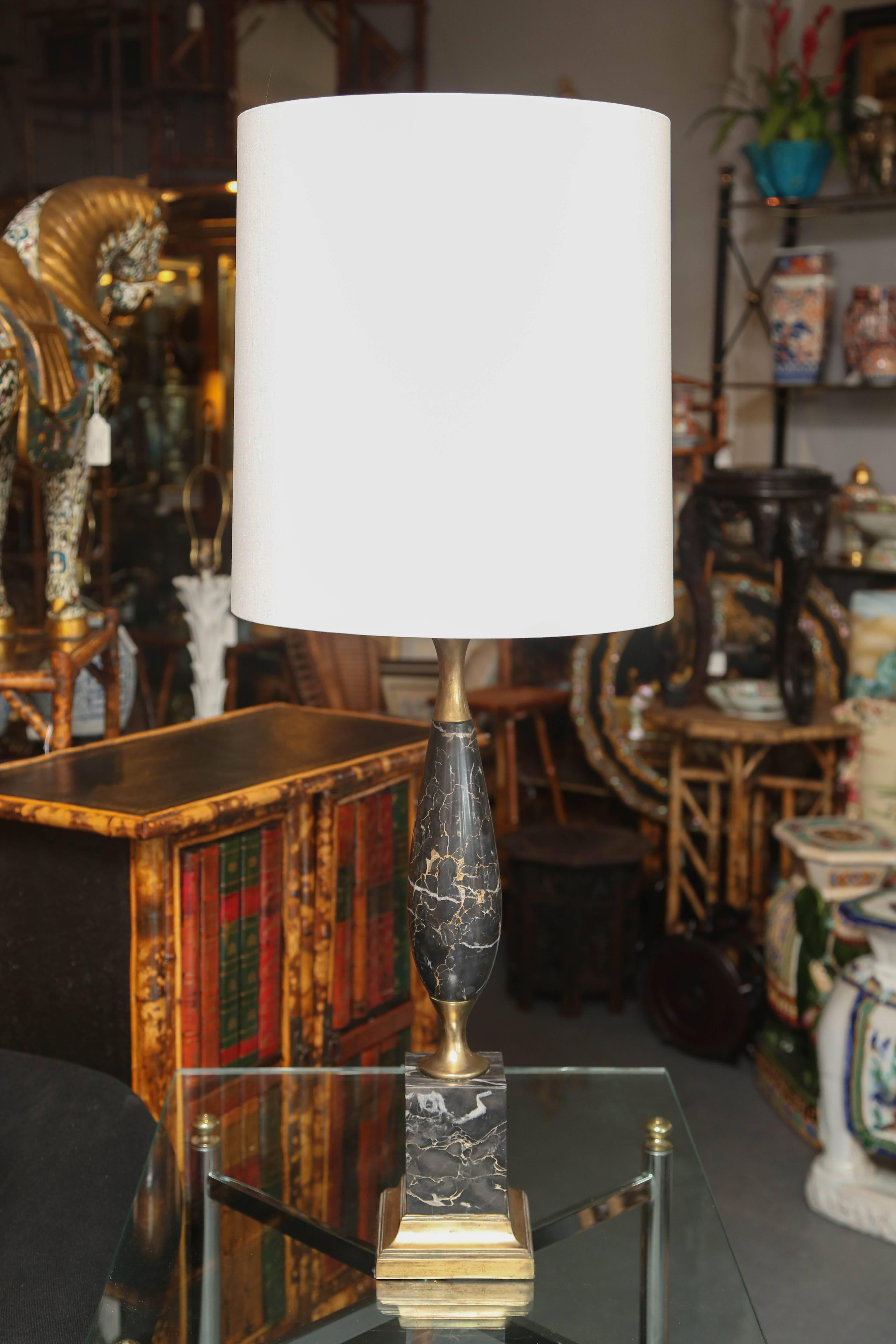 A stylish pair of tall and elegant lamps with brass appointments and custom shades. Measured to sockets. Overall height with shades is 38 inches.