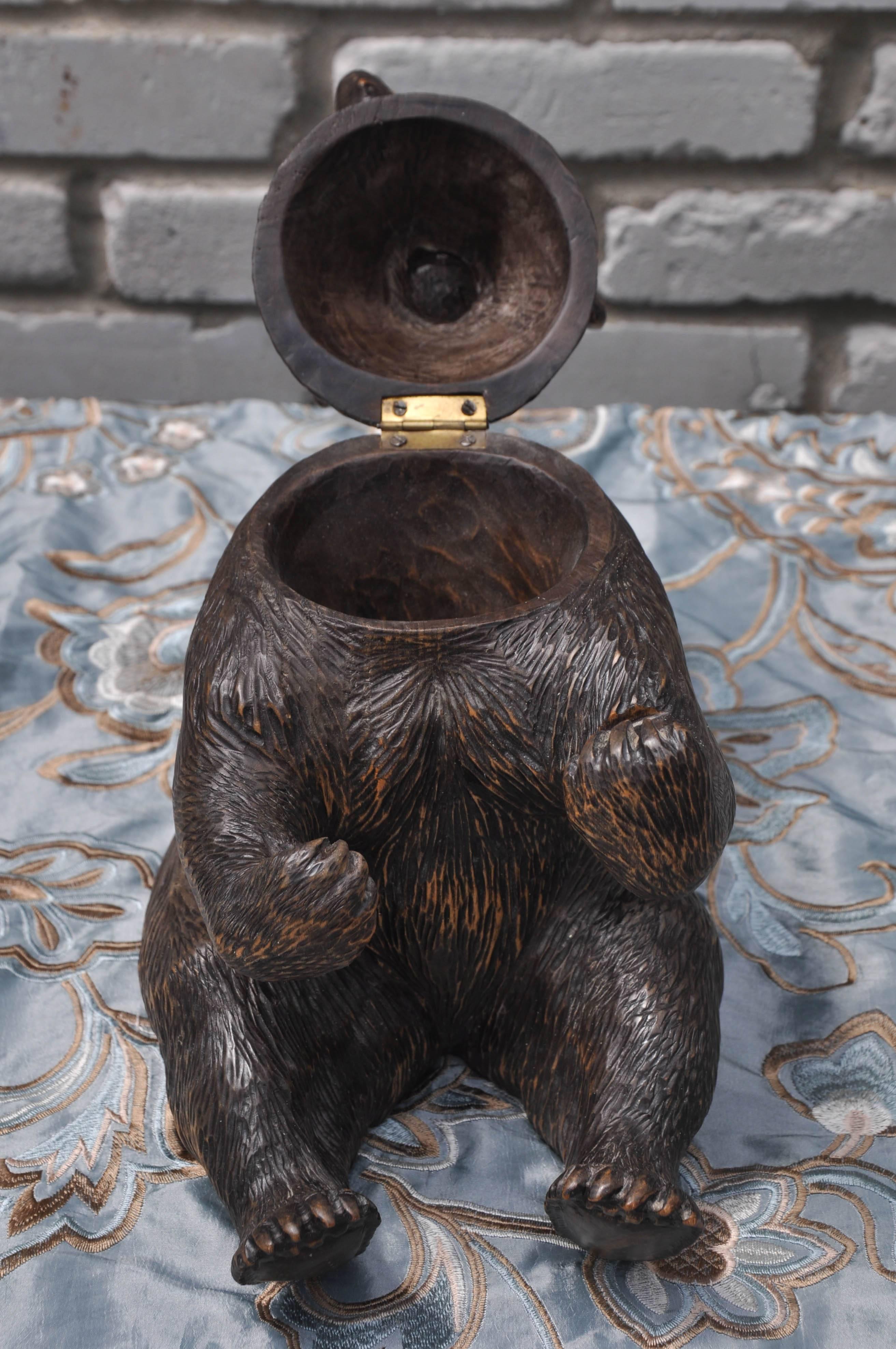 Brienz Black Forest Bear Humidor. Intricately hand-carved sitting bear, hinged head reveals storage for tobacco, glass eyes and outstretched arms give life-like feel. 
Brienz Black Forest Bear Humidor

 Brienz Black Forest Bear Humidor

 Brienz