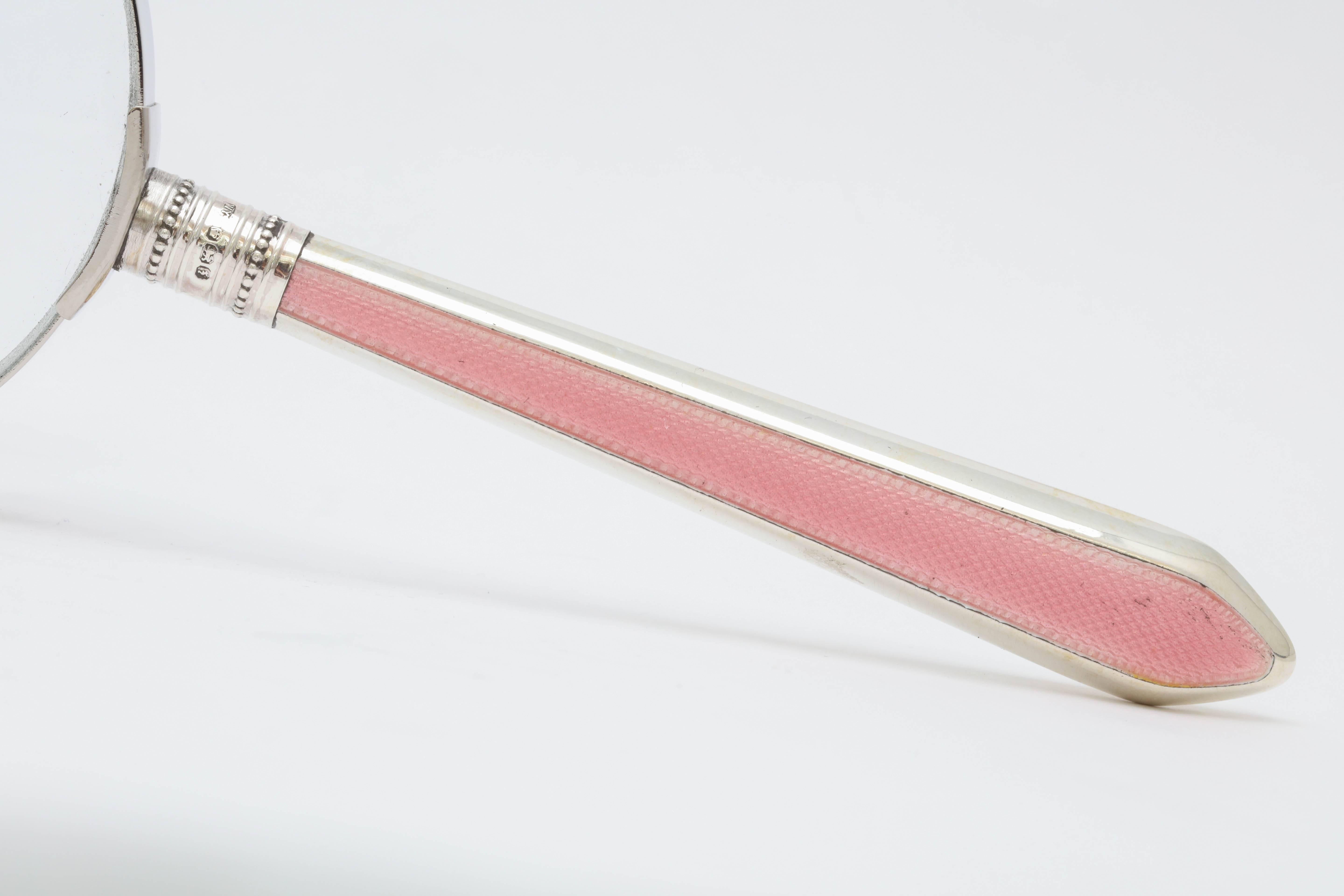 Art Deco, sterling silver handled, pink guilloche enamel mounted magnifying glass, Sheffield, England, 1917, William Yates - Maker. Measures: 7 1/2 inches long x 3 1/8 inches diameter. Excellent condition.
