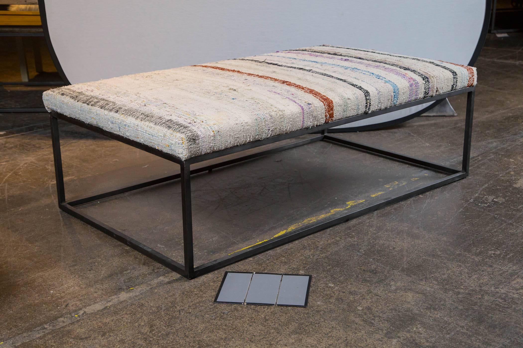 Swedish rag rug upholstered on steel frame.