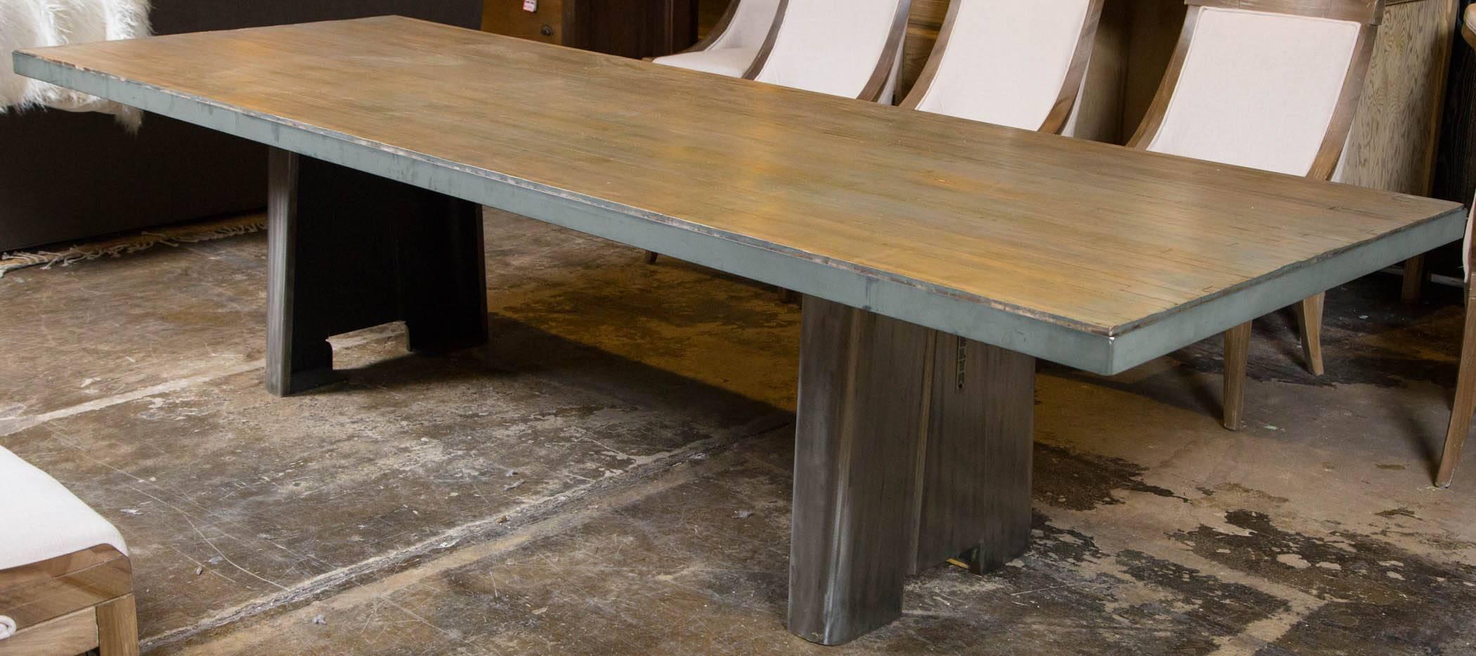 Reclaimed wood bowling alley tabletop on industrial steel base.