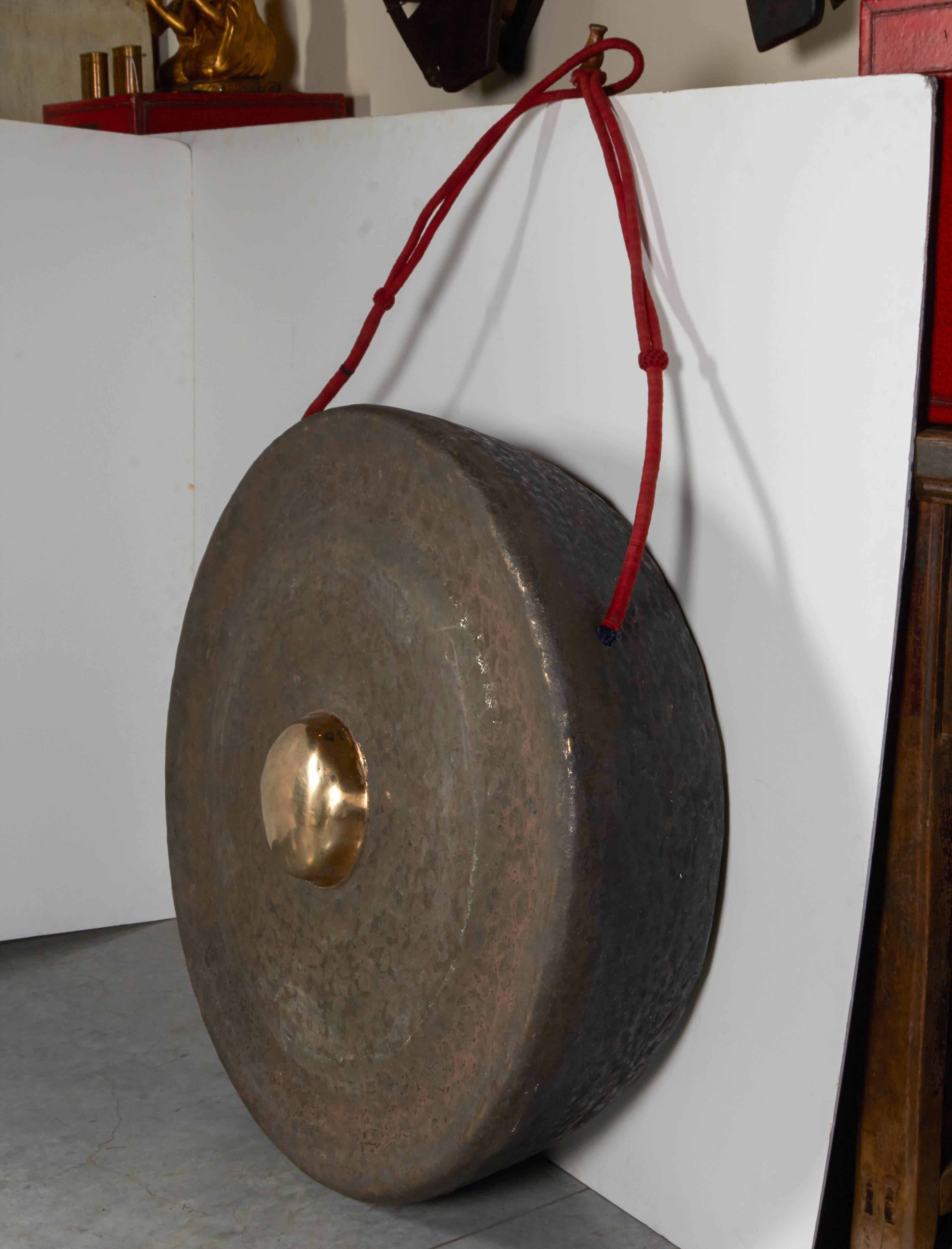 This huge, dramatic Javanese gong is the largest gong in the gamelan orchestra. It is 36 inches in diameter and a full 10 inches deep. The ageng gong has the lowest pitch in the orchestra and this particular piece has a beautiful, rich sound. The