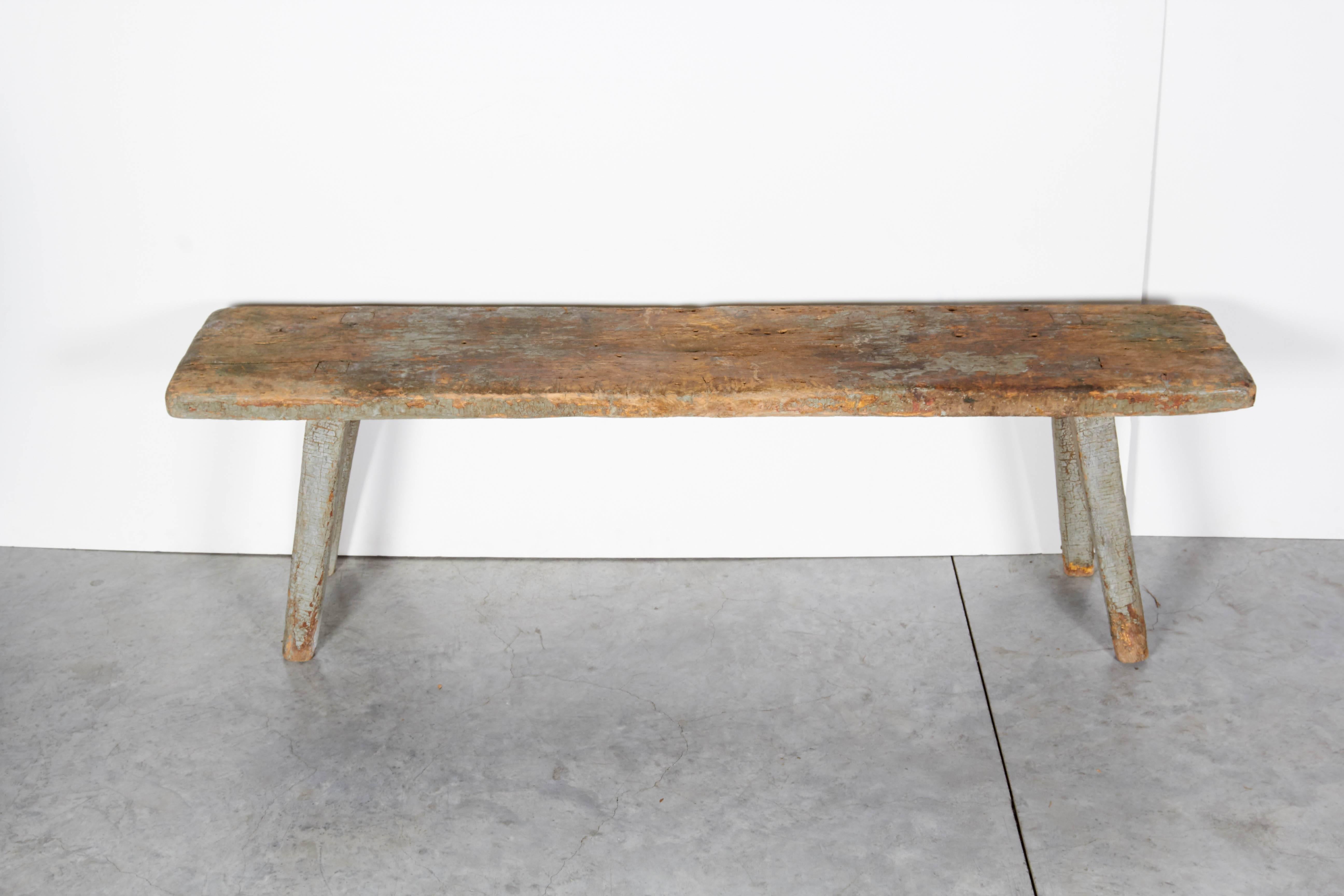 A beautiful country bench with fabulous patina reflecting it's years of use, including old nail holes and faded grayish paint. This low rustic American antique will add warmth and character to any room.
BN103.