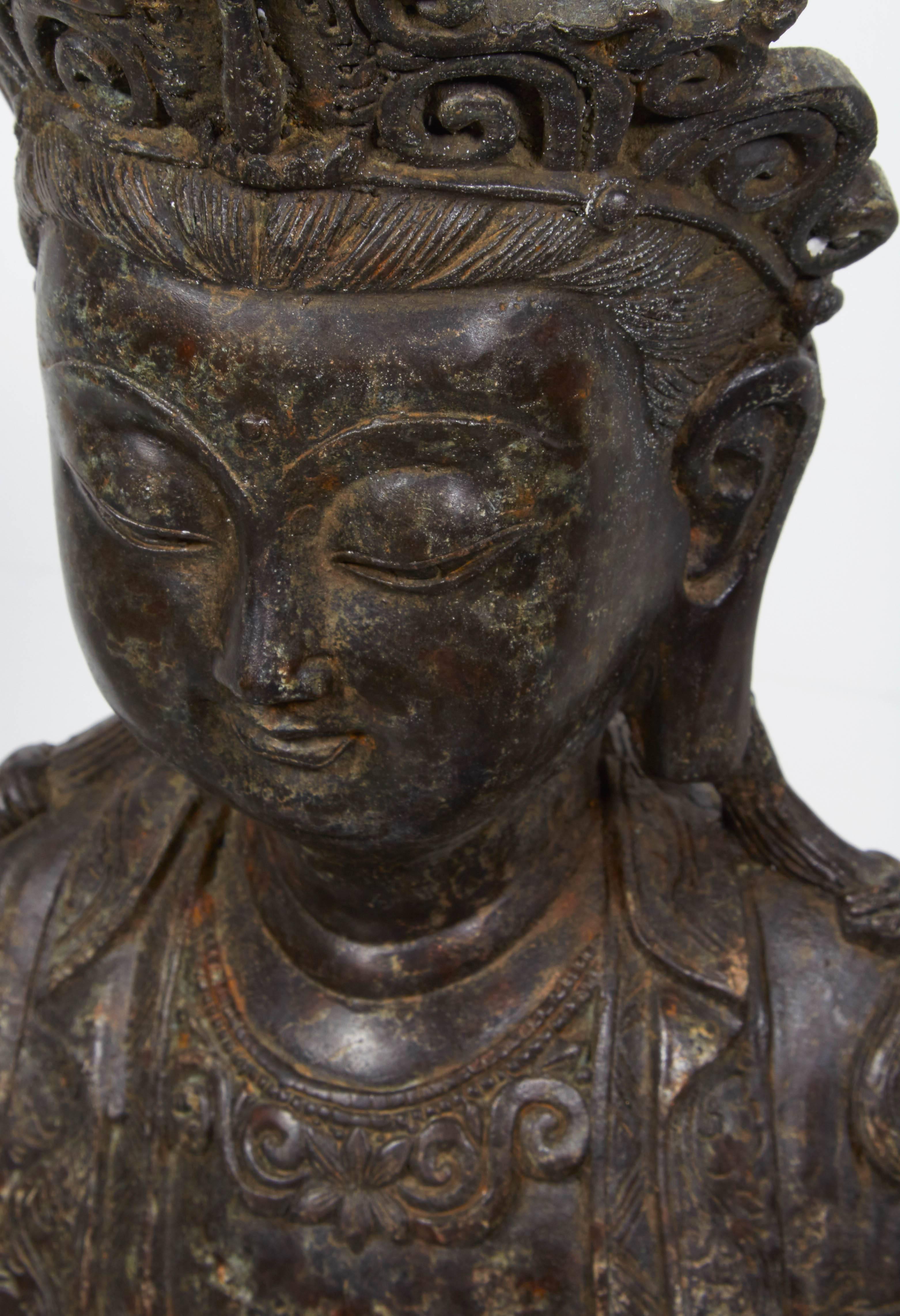 An unusually tranquil antique standing bronze Buddha with a sweet face and a remarkably calming presence. 

BH558.