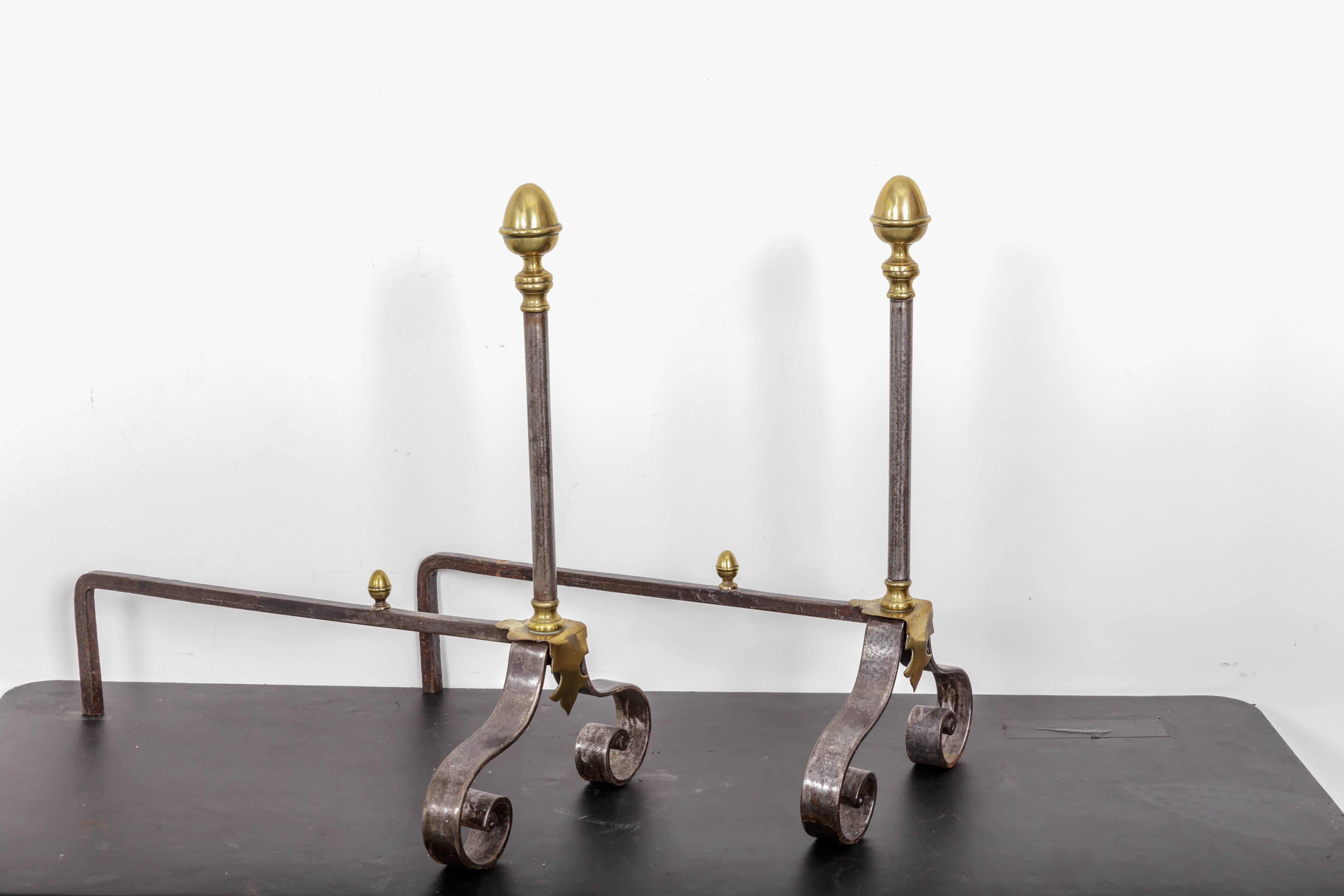 Brass and iron andirons with lemon top. Flat iron scroll bass, brass scroll plaque. Brass lemon shaped log stops. Pierced shovel, brass and iron poker and brass and iron log tongs. Measurements shovel 28 inch tall, poker 28 inch tall, tongs 27 inch