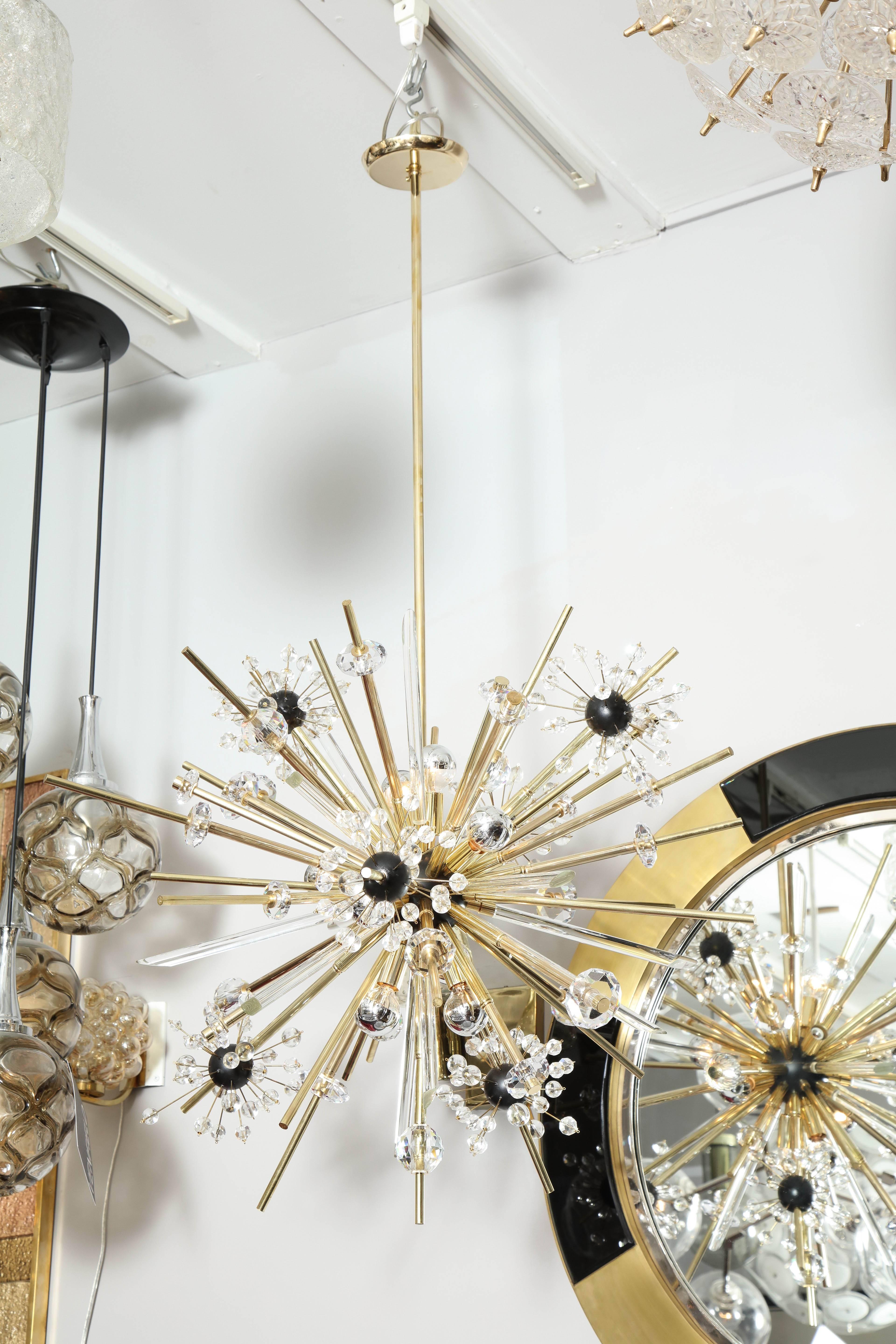 Exquisite crystal and polished brass Sputnik chandelier with ebonized spheres.