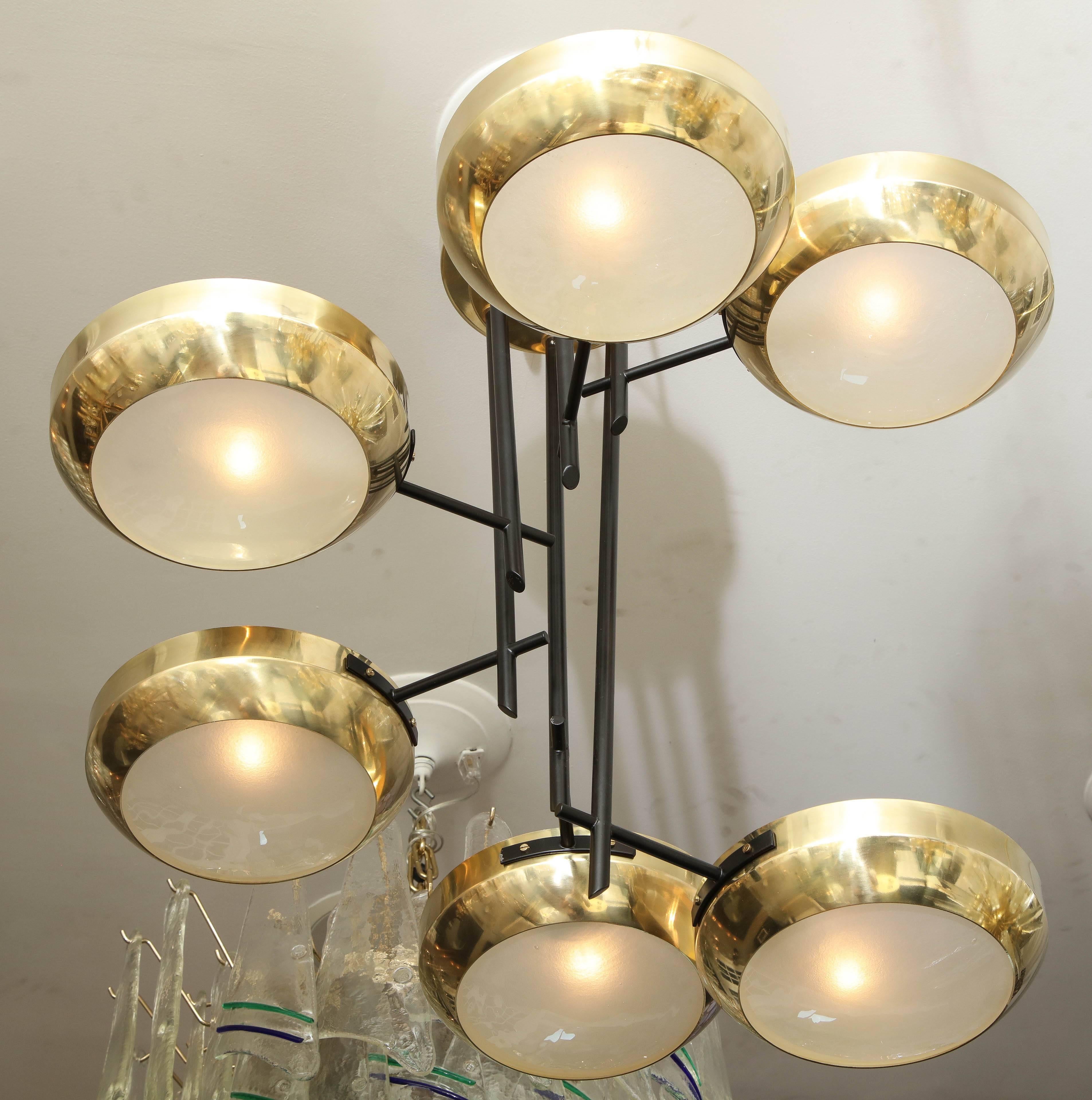 Six-arm ceiling light in the manner of Stilnovo. This is a floor model chandelier that is available as is for immediate purchase. It is in a like-new condition with minimum wear.