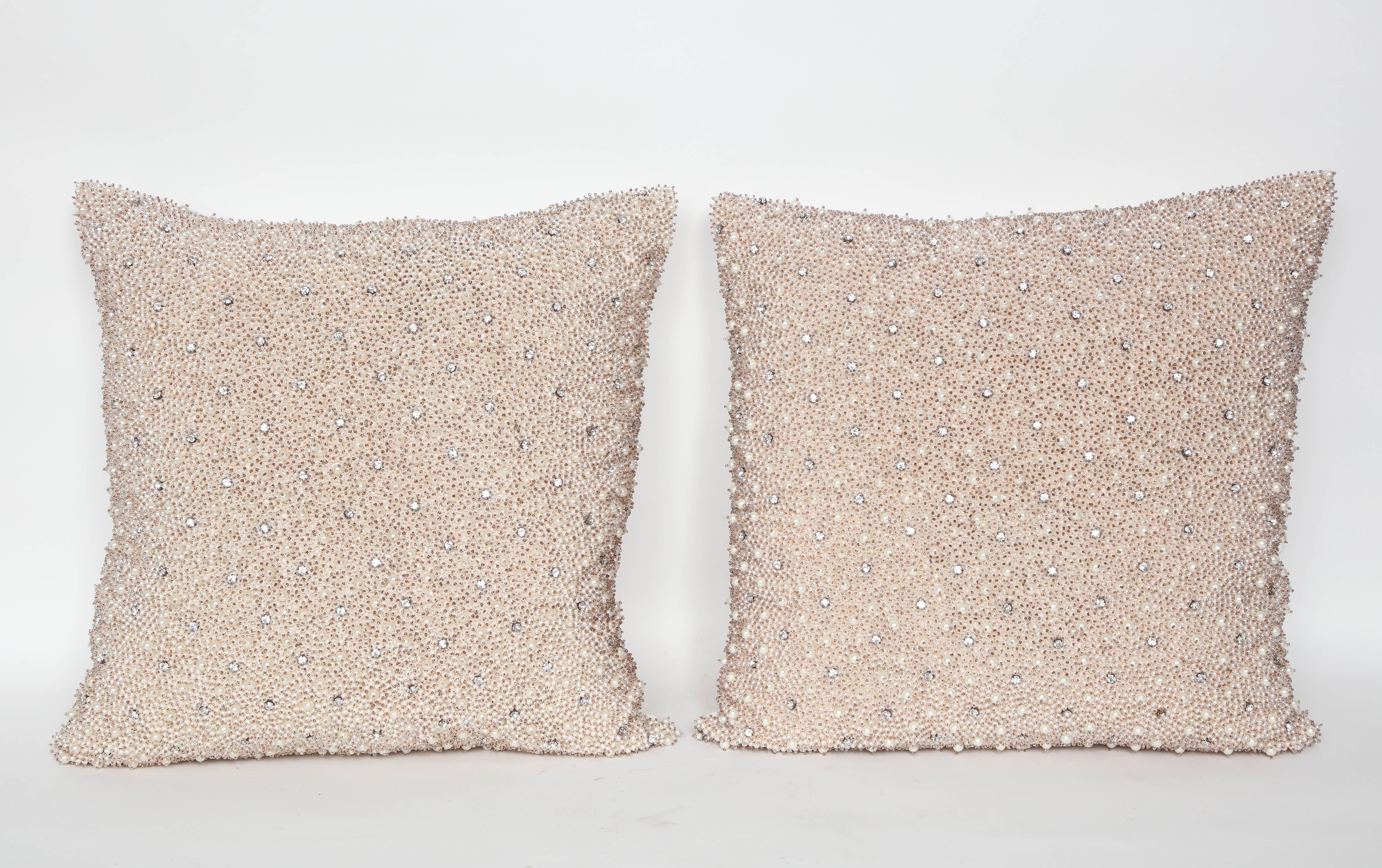 Stunning pair of pearl and rhinestone embellished pillows with ivory silk backs. Various pearls are accented with a crystal seed bead. Feather and down inserts hidden zipper closure.