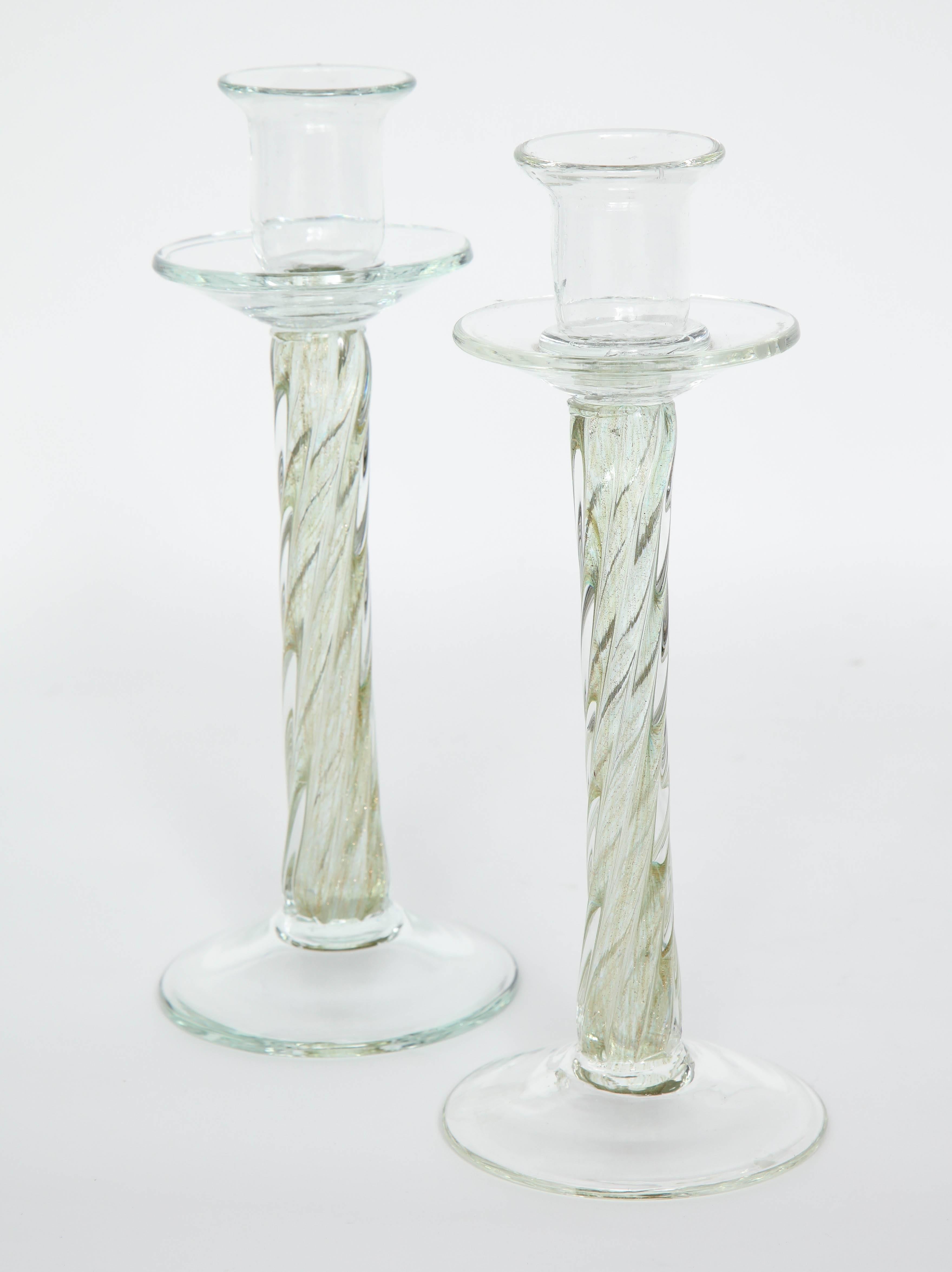 Pair of Mid-Century Murano glass candlesticks with pale green centers with 22-karat gold dust inclusions.