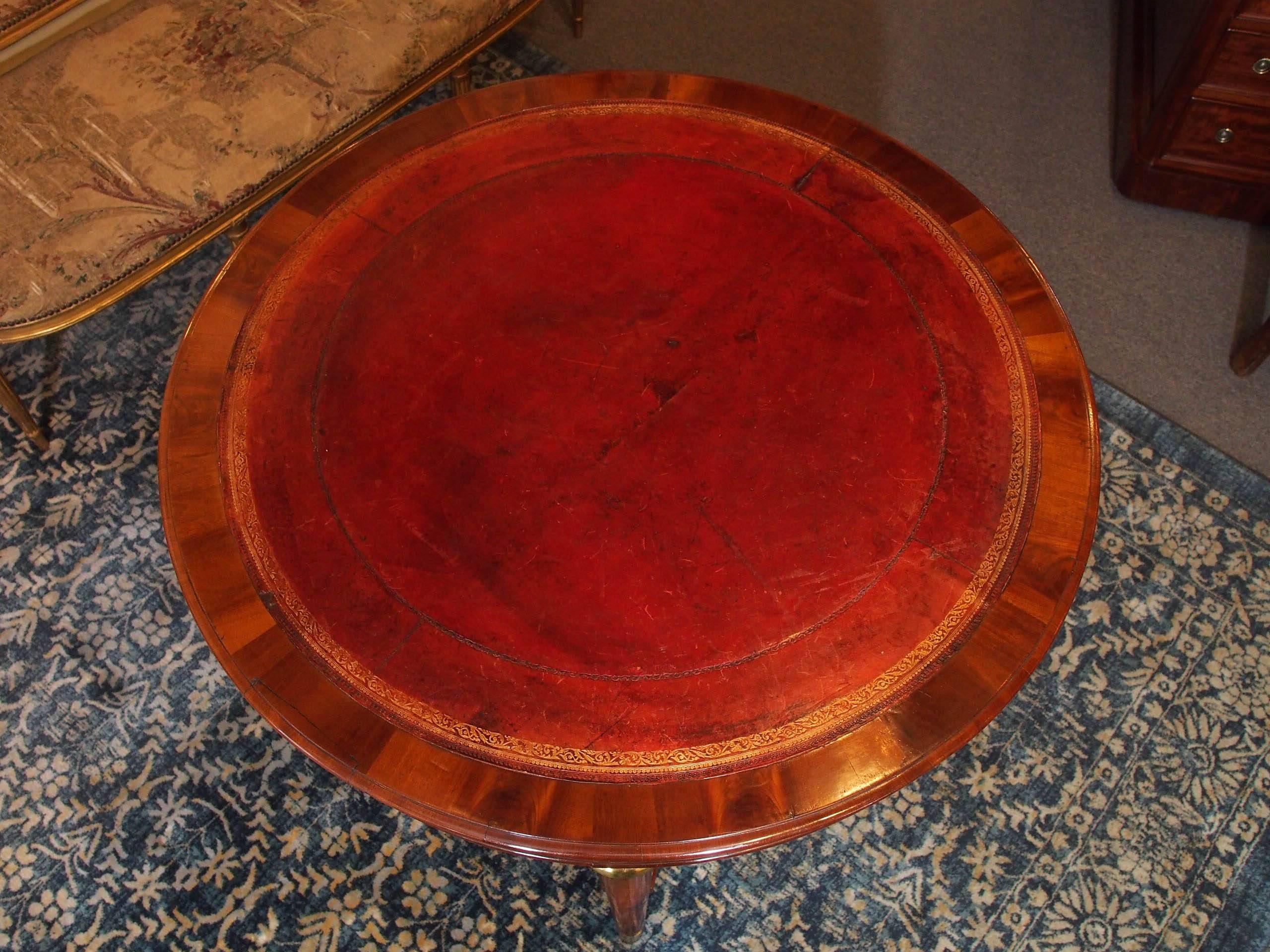 Antique French Louis Philippe mahogany leather top drum table, circa 1840.