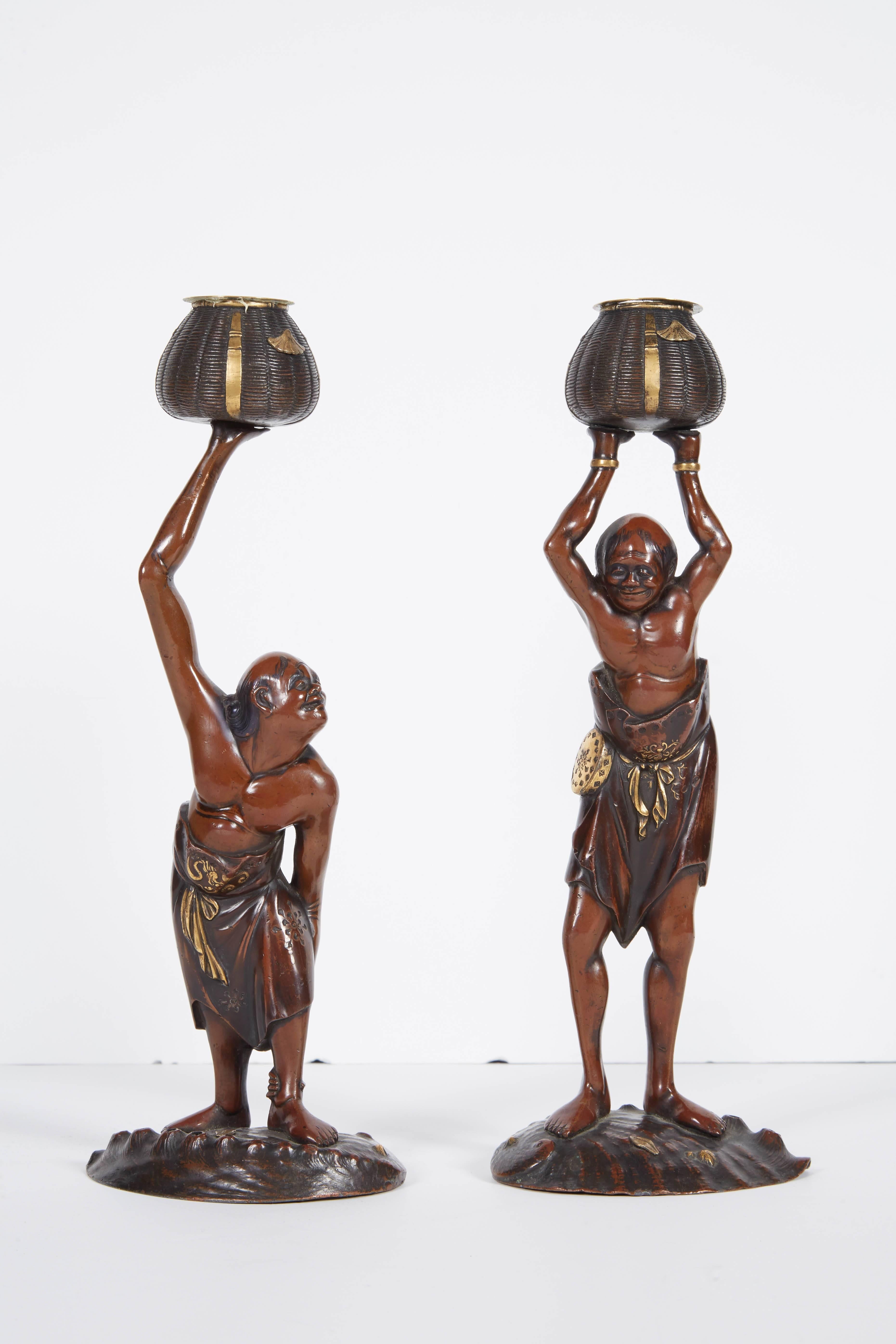 Exquisite pair of Japanese Meiji mixed metal bronze Oni figures from Japanese Mythology.

Depicting Ashinaga and Tenagu - they formed a partnership to go fishing. The long-legged figure would carry the other one on his back into the water and the