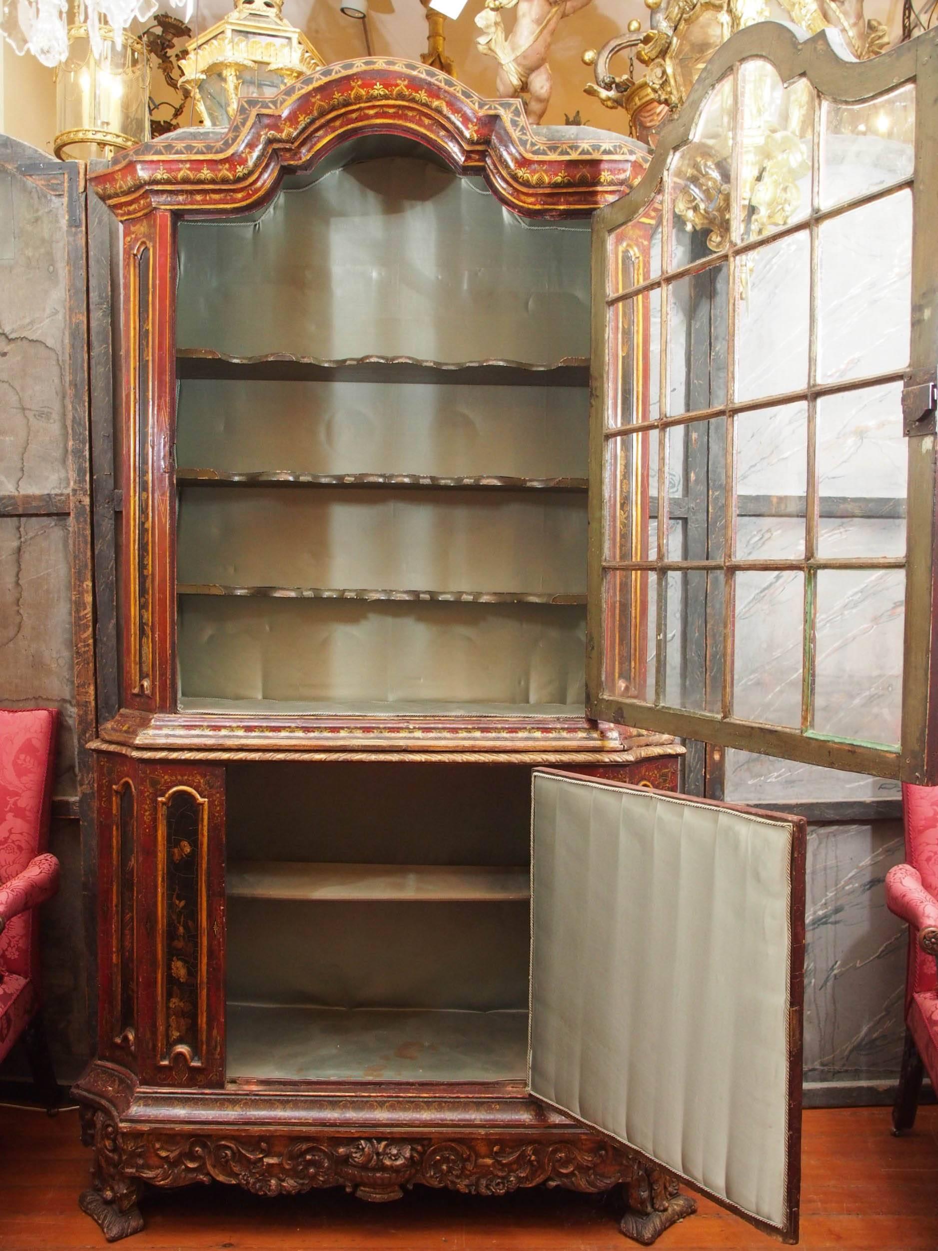 18th century bonnet topped chinoiserie decorated cabinet with astragal glass door and solid panel door beneath.