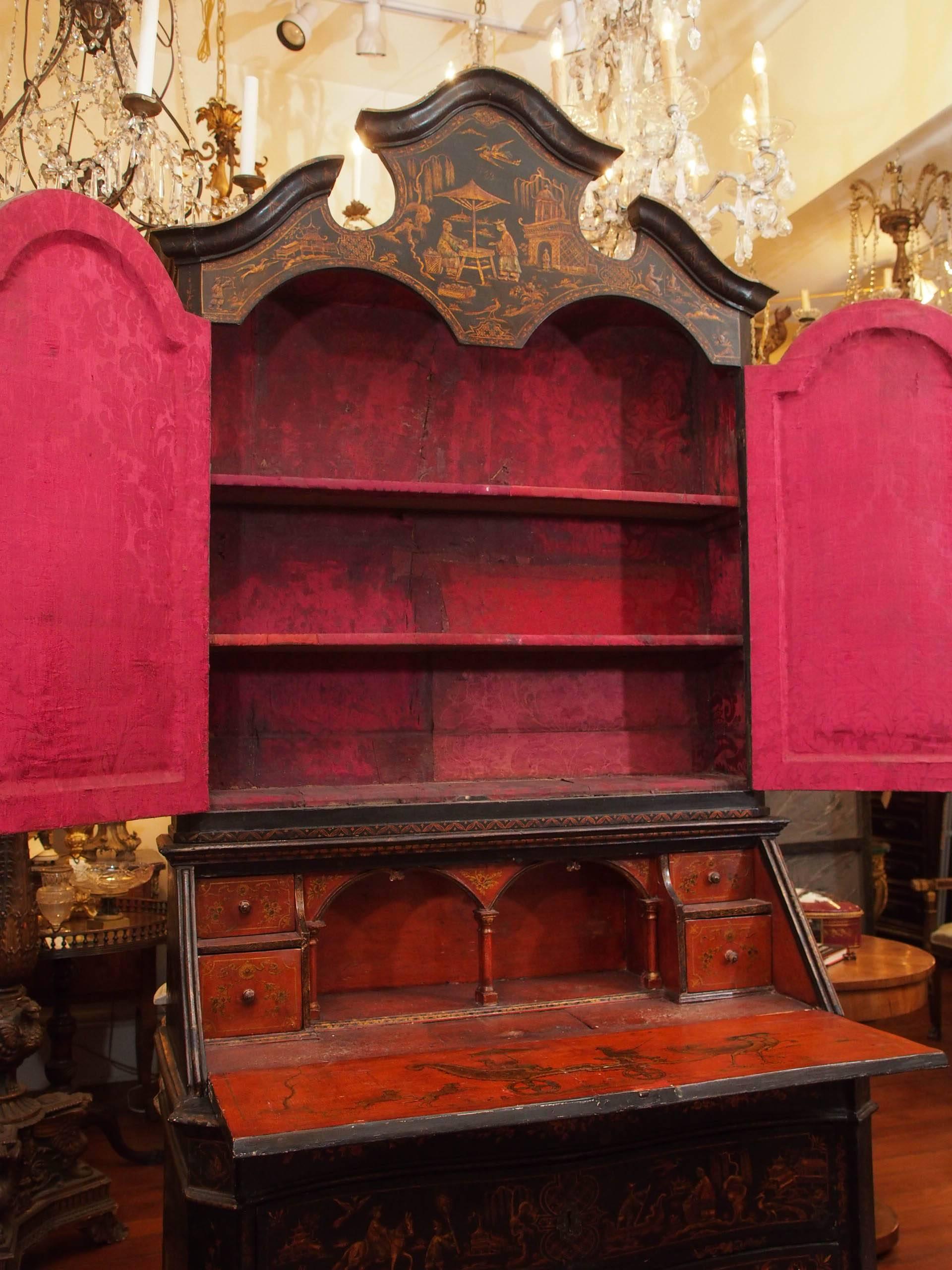 Exceptional 18th century lacquered secretary bookcase with mirrored doors. The lacquer features snake charmers and a chinoiserie scenes with children. 
This came from an important Palazzo in Venice. The interior has been covered in silk damask and