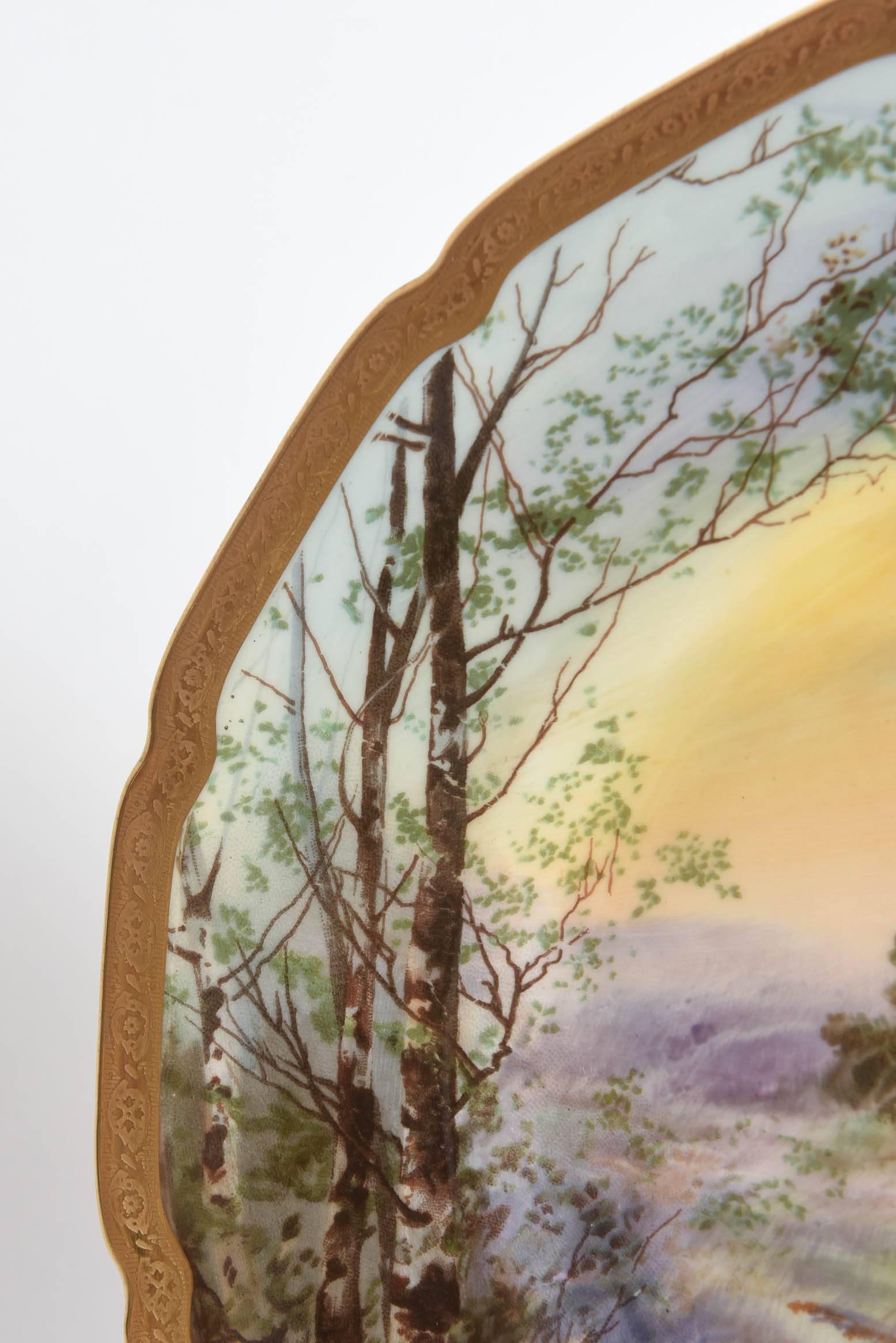An exquisitely fully painted porcelain plate for wall or cabinet display hand-painted by Charles Hart for Royal Doulton, England. Herstmonceux / Hurstmonceaux is a regal 15th century castle in East Sussex England and a popular one for the English
