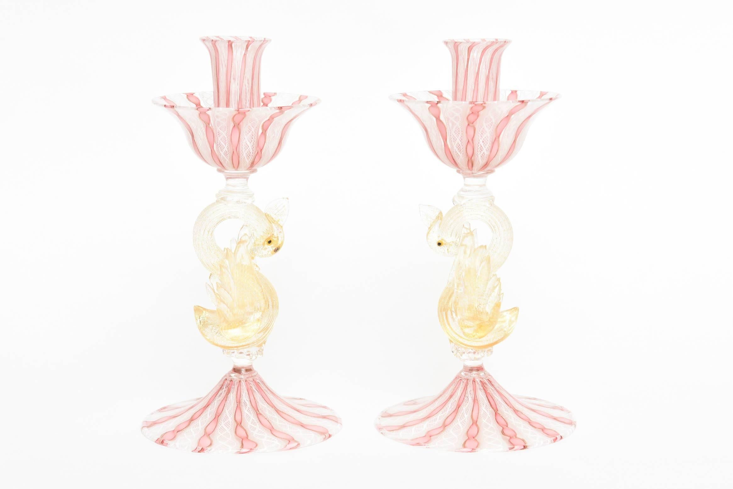 So pretty in pink, these delightful vintage candleholders are just beautiful on their own and feature large detailed swans supporting elongated bobeches and a nicely sculpted wide base. 24-karat gold is accented nicely throughout and they are in