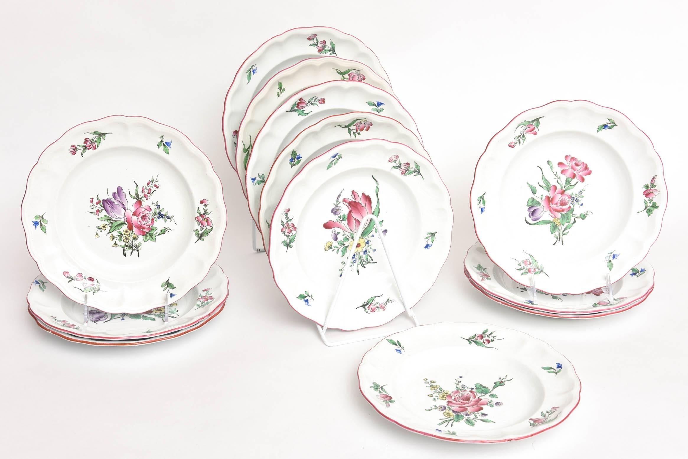 A delightful and charming set of 12 plates which feature different florals. While these plates are almost a hundred years old, this pattern has been made in many different combinations and still continues to be made. Timeless and so fresh and