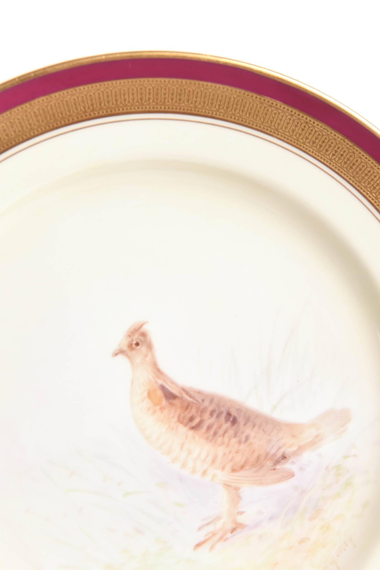 A lovely set of antique and detailed game bird plates by Lenox and circa 1920. Custom ordered through the fine Philadelphia Gilded Age Retailer of Bailey, Banks, & Biddle. Each plate meticulously painted and signed on the back. All-over full flora