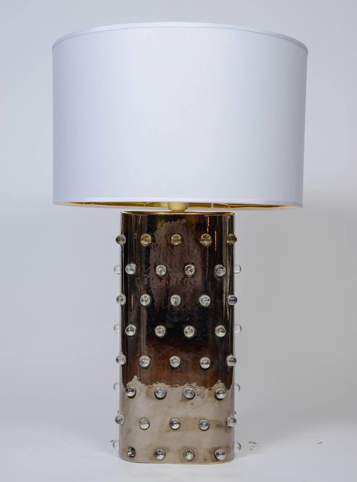 Pair of table lamps made of glazed ceramic with small plastic marbles embedded.