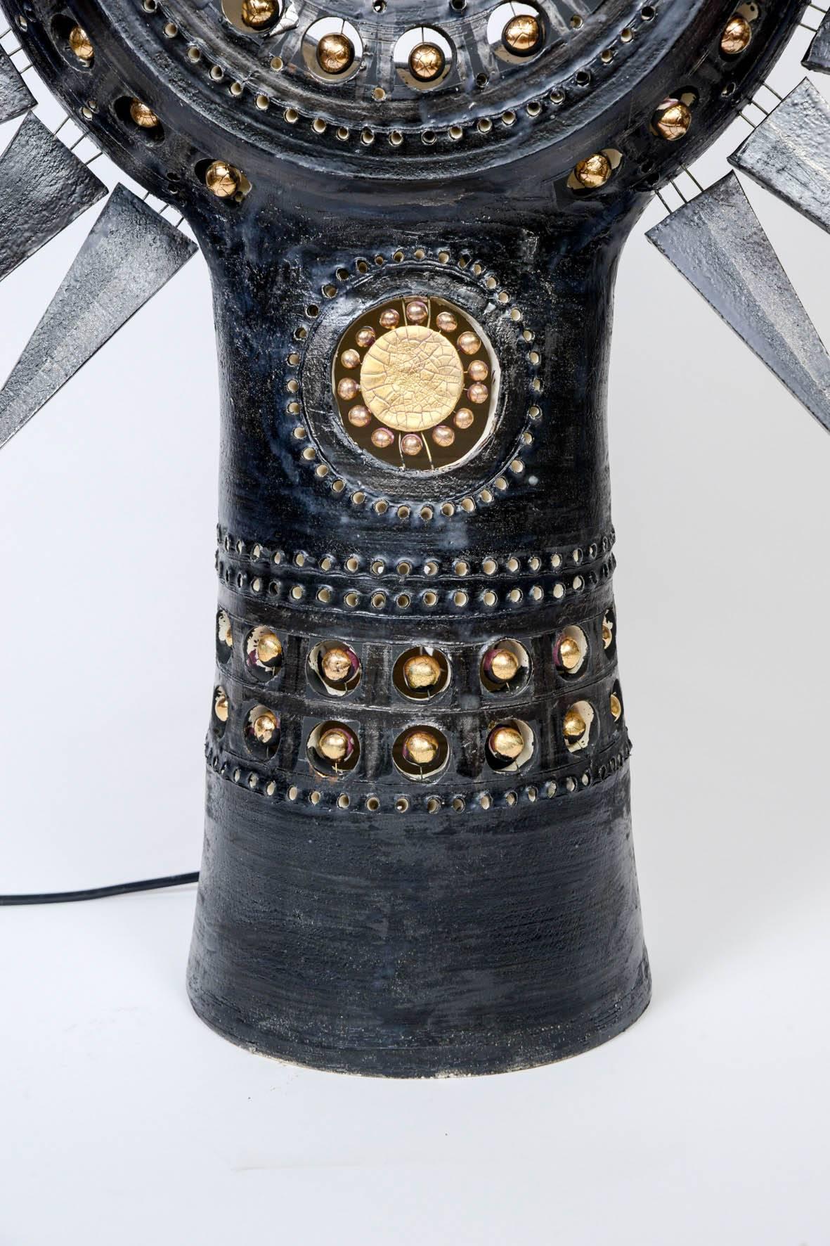 Hypnotic table lamp made in ceramic painted in black with hints of gold leaf, by the French artist Georges Pelletier.