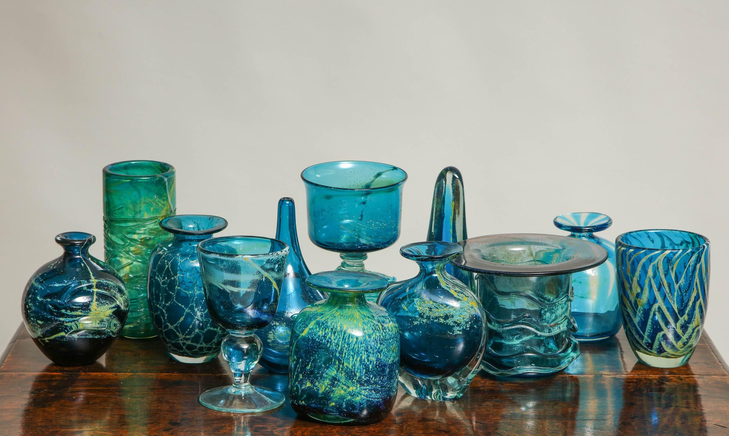 Fine collection of 1960s-1970s studio art glass from Malta, in rich deep blues, greens and gold’s from Mdina, the glass works established on the island in the 1960s by English glass artist Michael Harris.  Price below for entire collection of 12