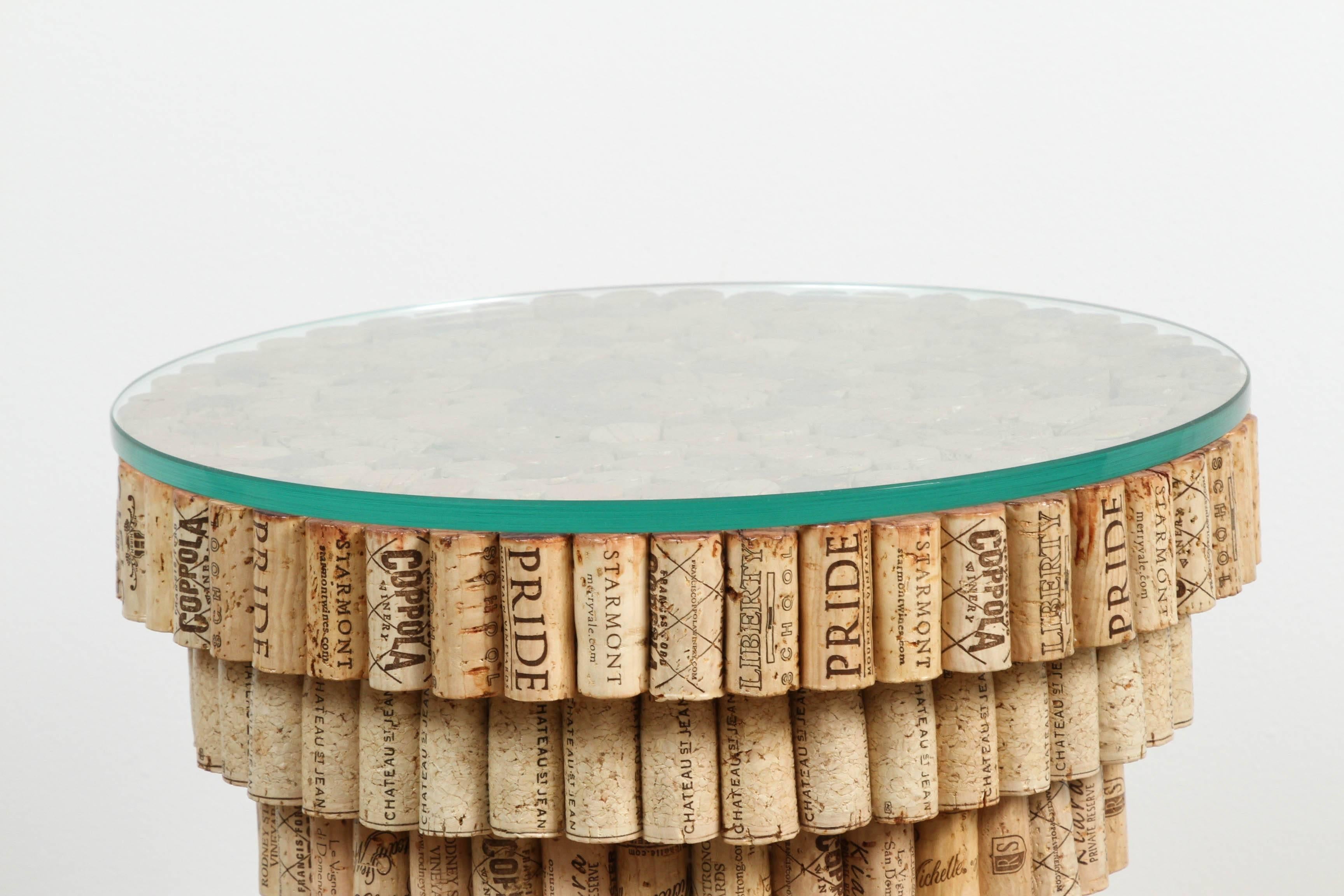 Industrial end table made out of recycled and repurposed wine corks and polymer with glass top. Karyl Sisson is in public collections such as the Museum of Arts and Design in New York, Museum of Fine Art in Boston and several more. Her resume upon