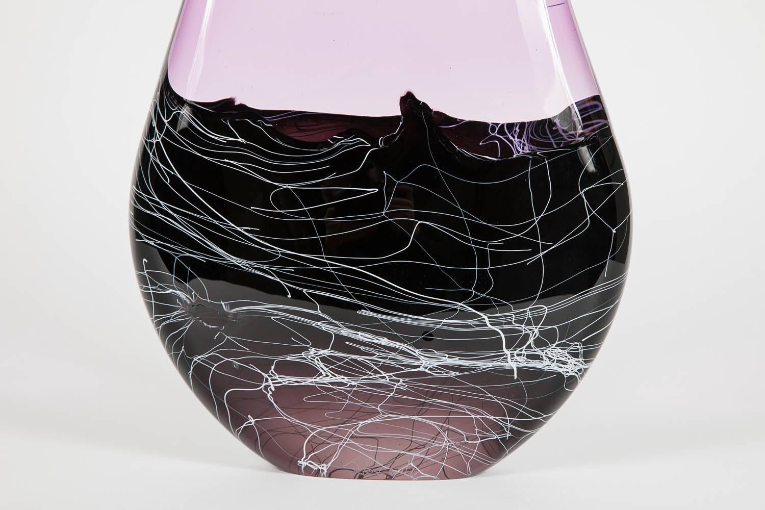 Purple Metamorphic is a unique sculpture in purple, white, black and clear, created from solid molten glass by the British artist James Alexander.

James Alexander is a glassblower and artist who has worked freelance for a number of studios since