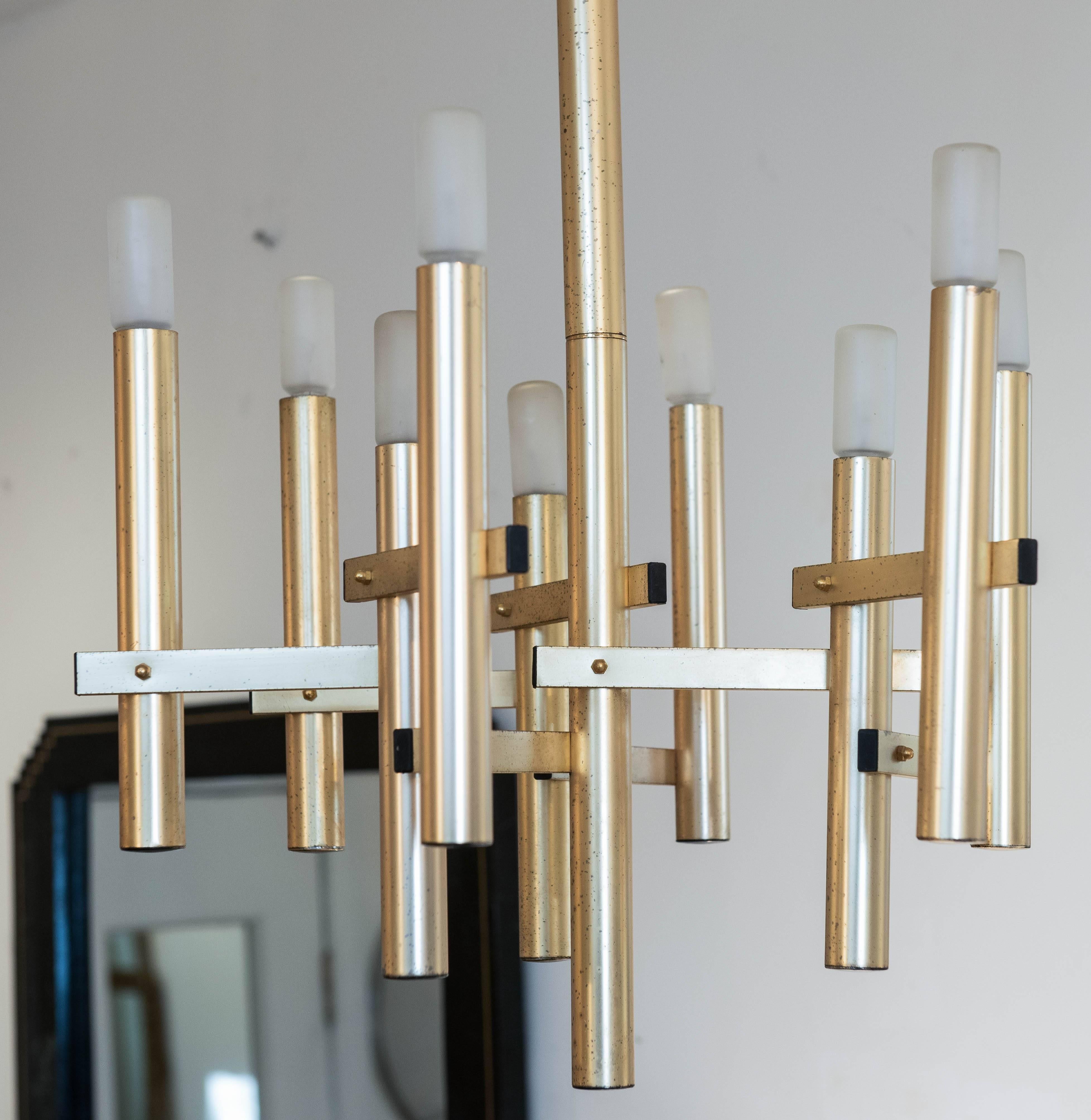 This appealing and simple Sciolari style nine light pendant is finished in 
