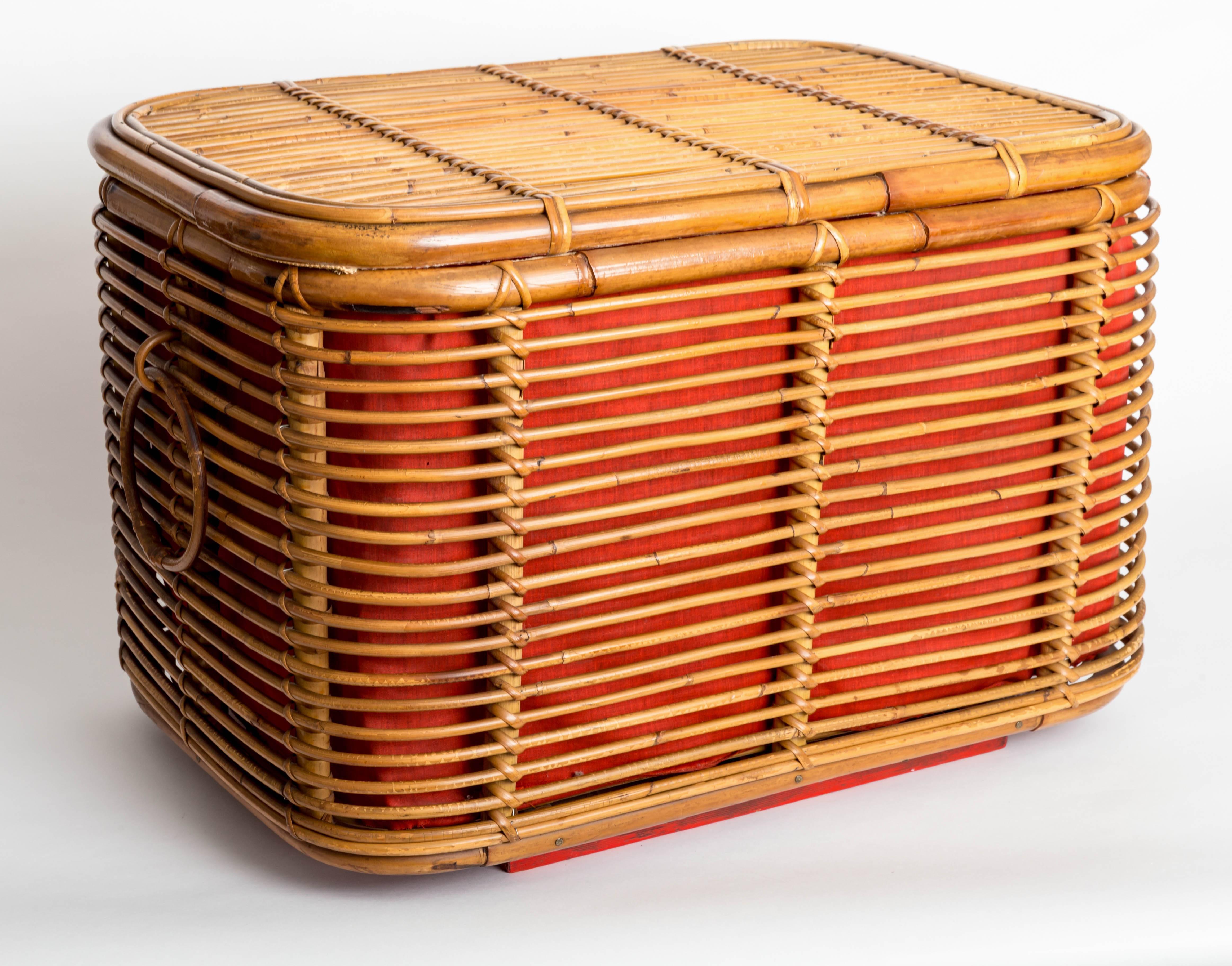 Rattan ottoman or storage chest with fabric lining.