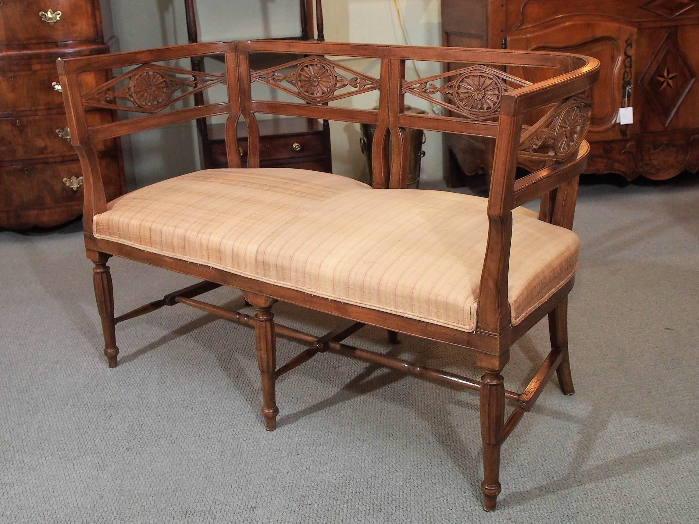 Antique French fruitwood settee. Directoire style, circa 1850.