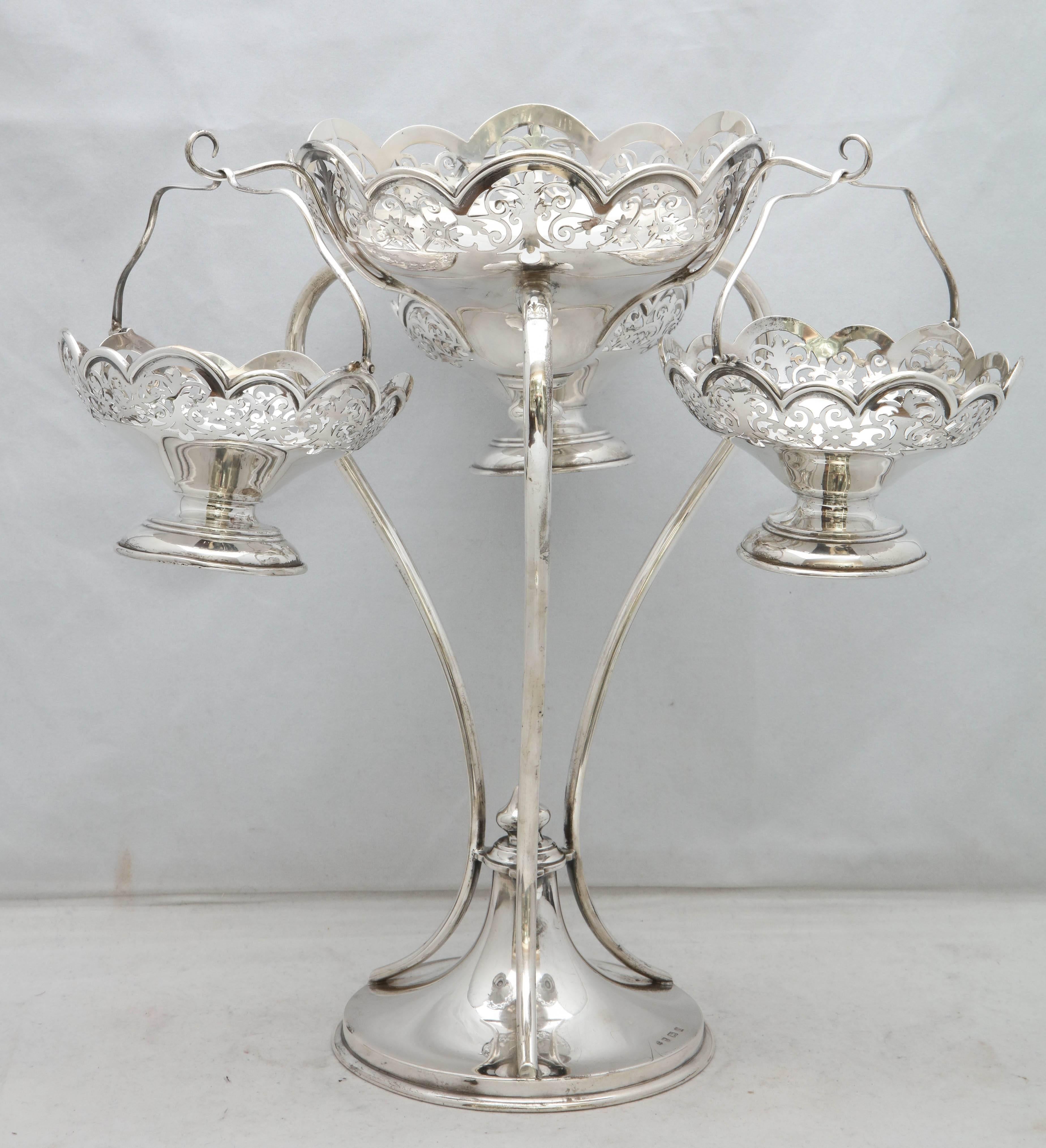 Beautiful, Edwardian-style all sterling silver epergne/centerpiece (made during the reign of King George V) having three hanging, removable sterling silver baskets and one central, stationary bowl, Birmingham, England, 1919, Charles S. Green and Co.
