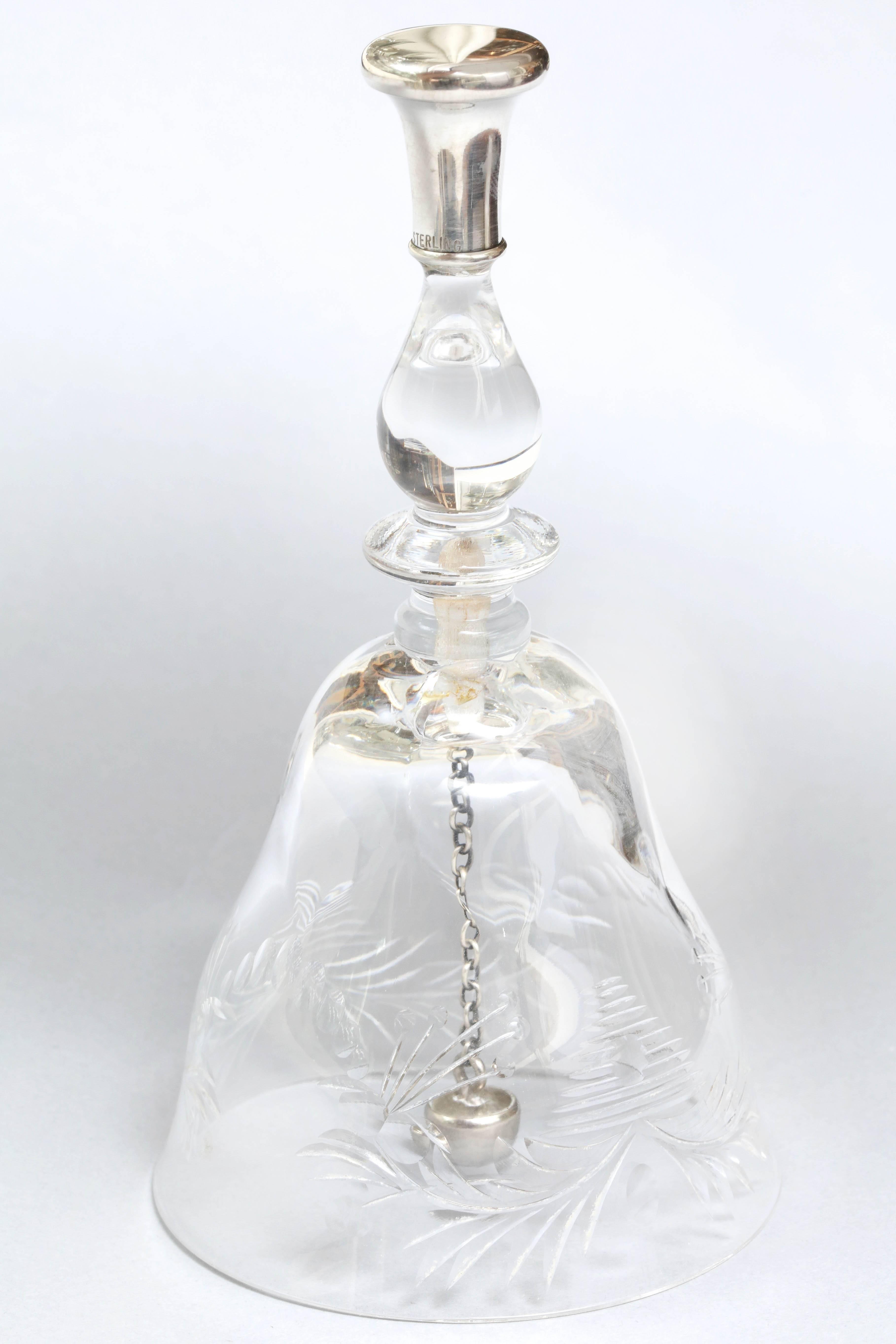 Beautiful, Edwardian, sterling silver mounted, wheel cut crystal, dinner bell, American, circa 1905. Sterling silver clapper produces a lovely, clear sound. Measure: 5 3/4 inches high x 3 inches diameter across base. Lovely, delicate cutting on