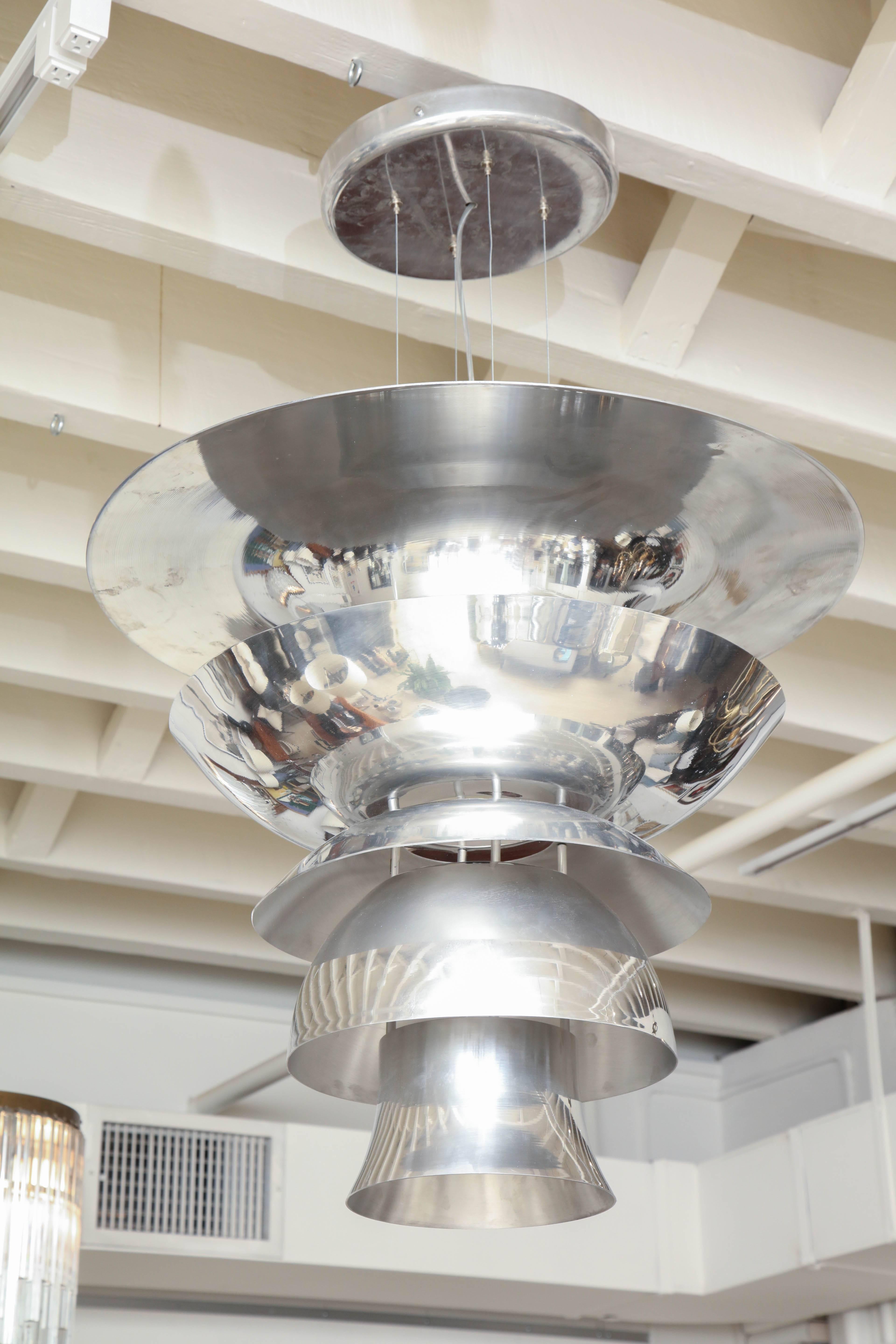 Large multi-tiered aluminum pendant light fixture. Newly rewired for US specifications. Height adjustable from canopy to light fixture.
.



Available to see in our NYC Showroom 
BK Antiques
306 East 61st St. 2nd fl.
New York, NY 10065